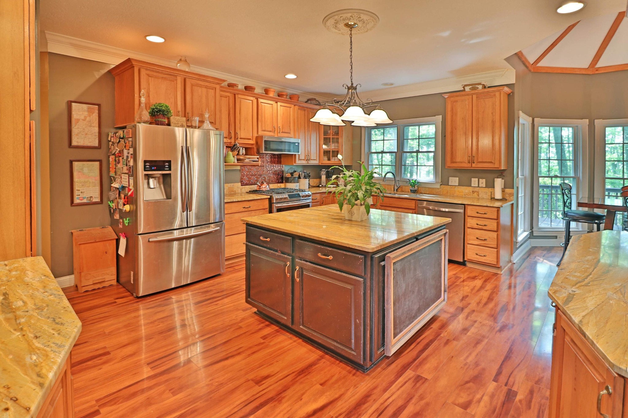 281 Lone Ridge Lane Clinton, TN 37716 - Photo 8 of 40 a kitchen with wooden cabinets and stainless steel appliances