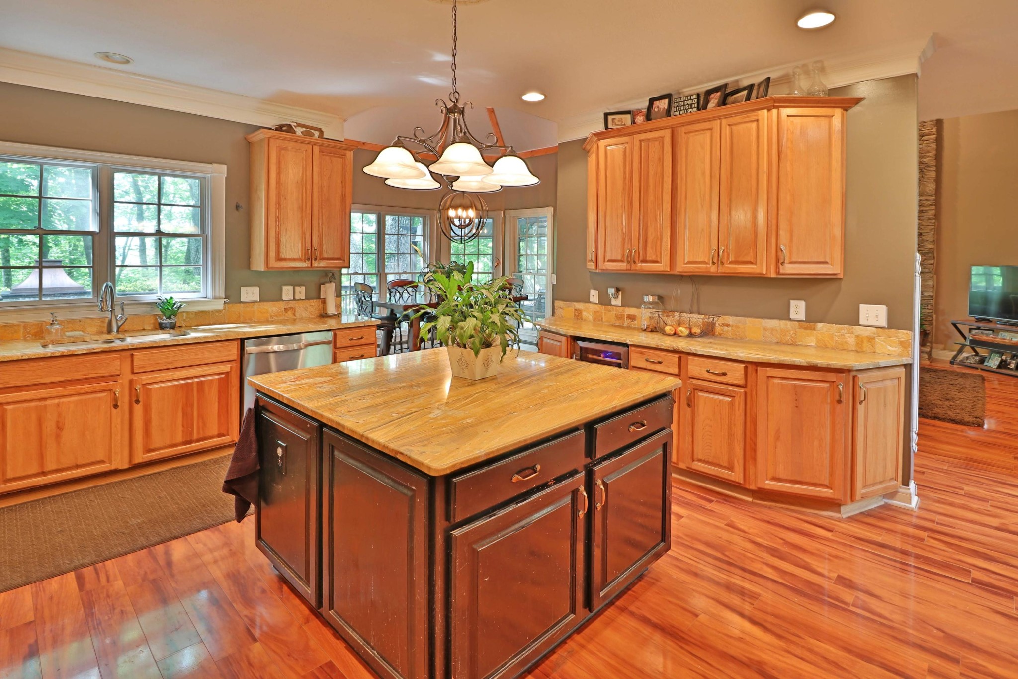 281 Lone Ridge Lane Clinton, TN 37716 - Photo 9 of 40 a kitchen with a sink stove and wooden cabinets