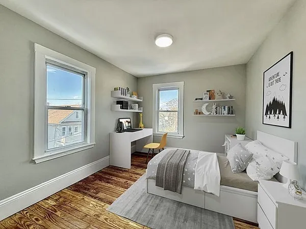 a bedroom with furniture and a window