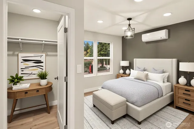 a bedroom with a bed and a table