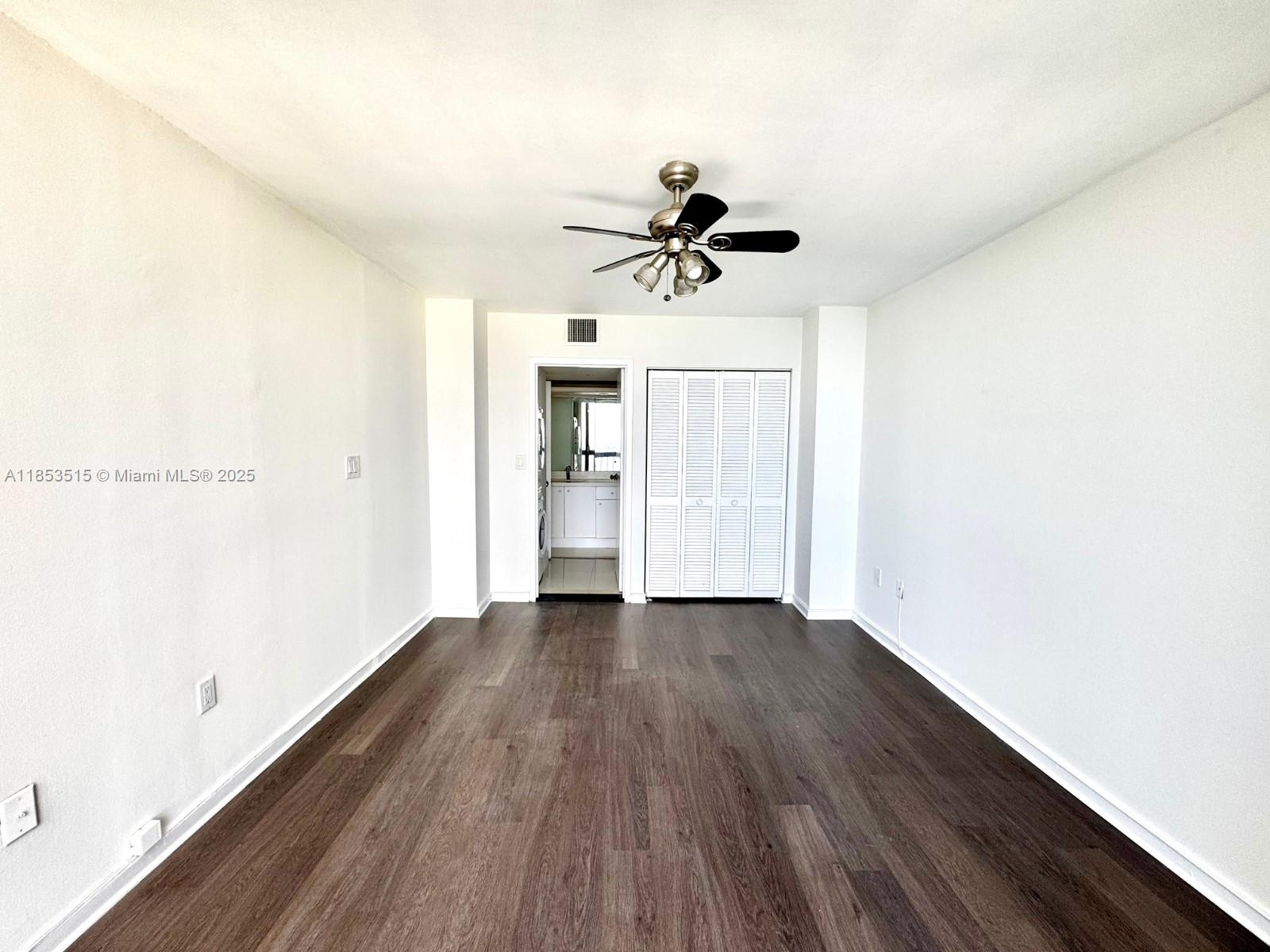 2333 Brickell Avenue, Unit 2607 Miami, FL 33129 - Photo 11 of 23 a view of empty room with wooden floor
