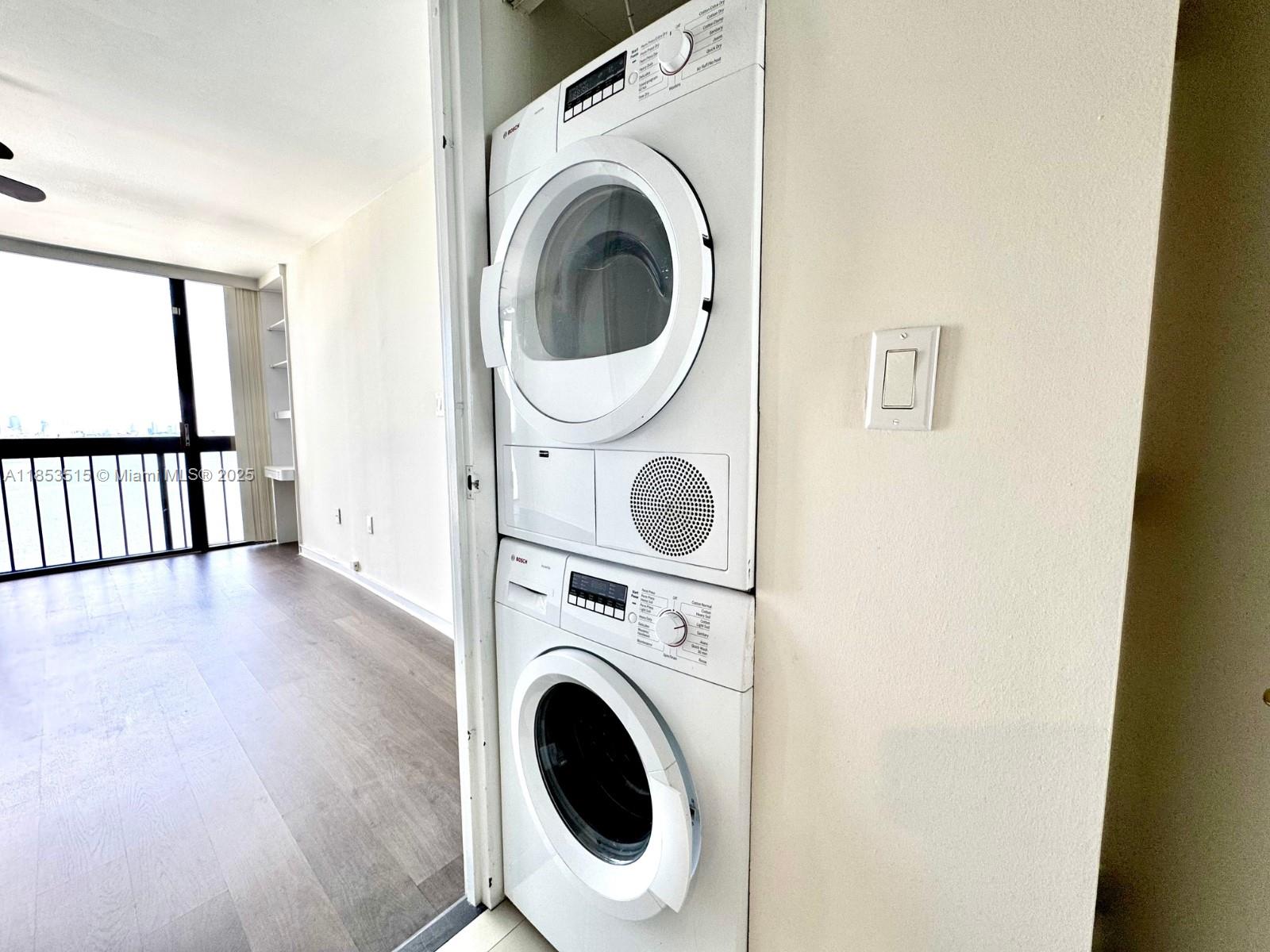 2333 Brickell Avenue, Unit 2607 Miami, FL 33129 - Photo 14 of 23 a view of a hallway with washer and dryer