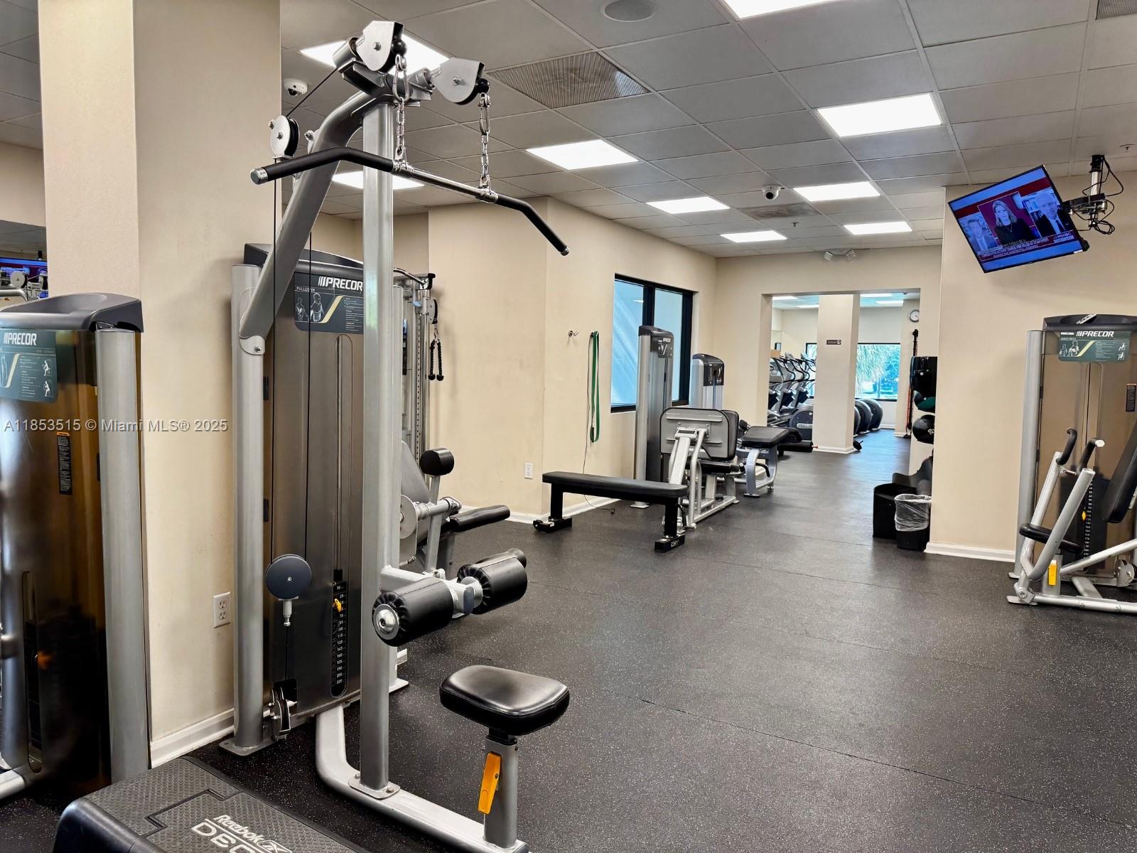 2333 Brickell Avenue, Unit 2607 Miami, FL 33129 - Photo 20 of 23 a room with gym equipment and a mirror