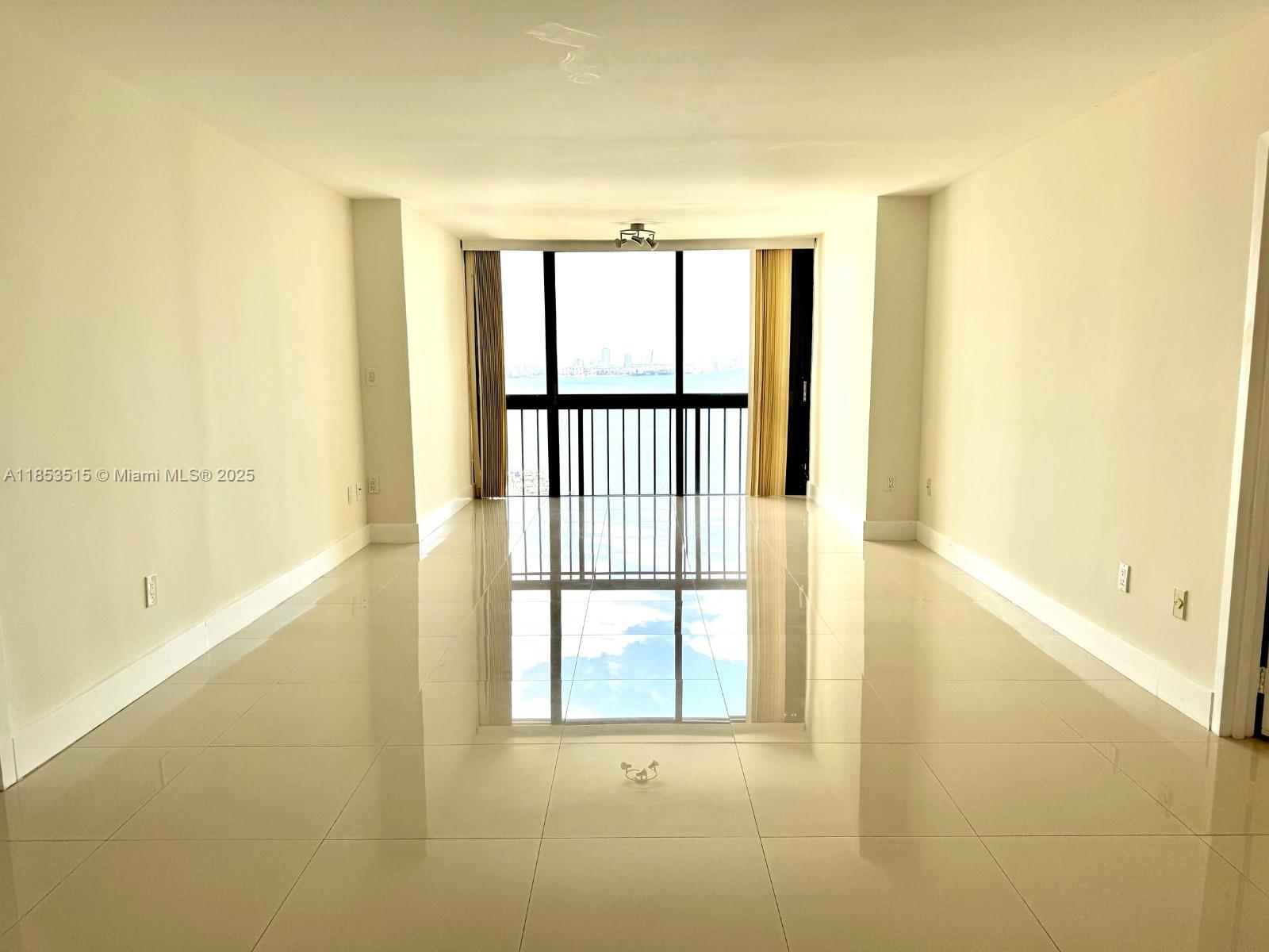 2333 Brickell Avenue, Unit 2607 Miami, FL 33129 - Photo 2 of 23 a view of an empty room with a window