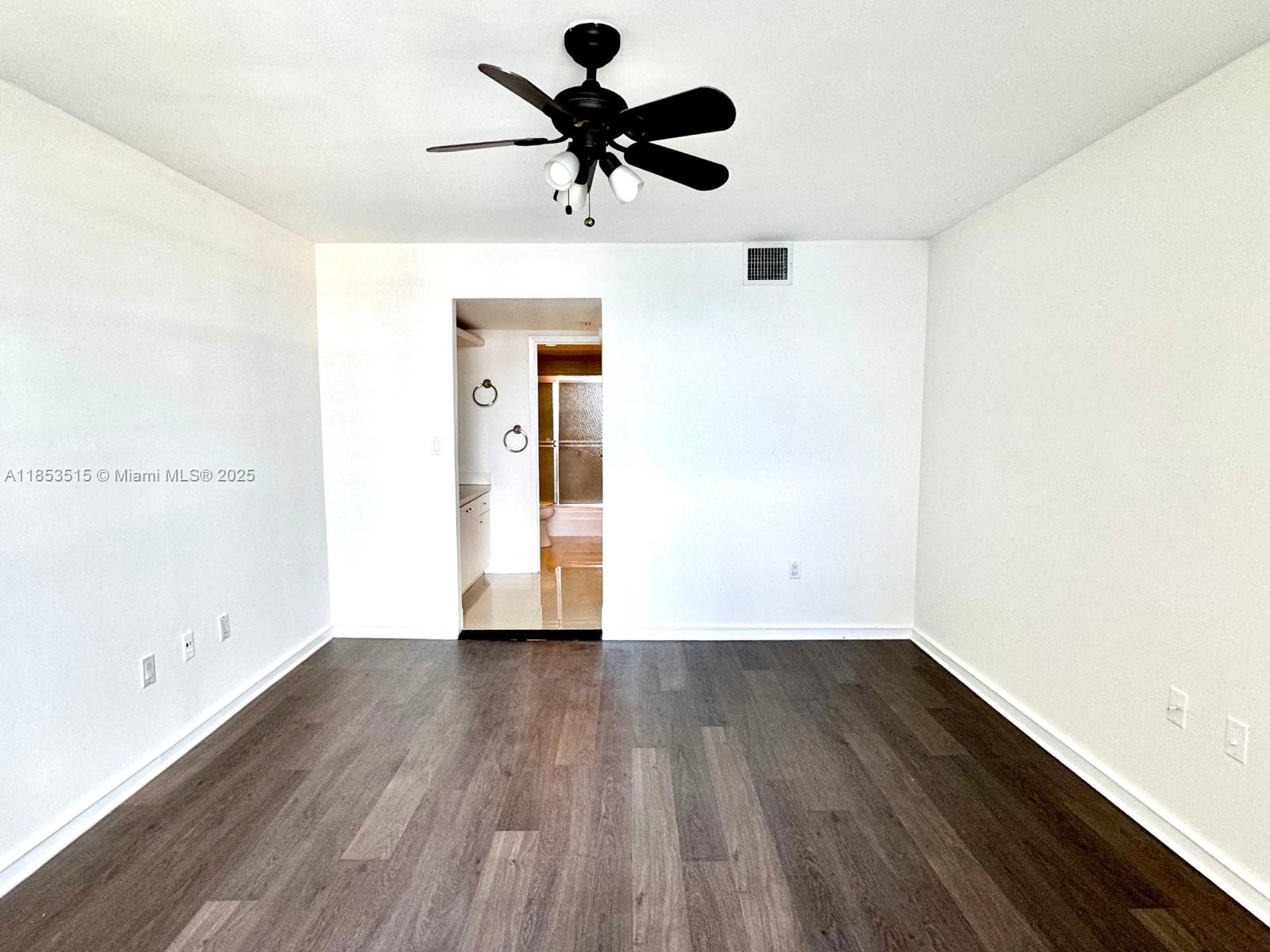 2333 Brickell Avenue, Unit 2607 Miami, FL 33129 - Photo 6 of 23 a view of an empty room with wooden floor