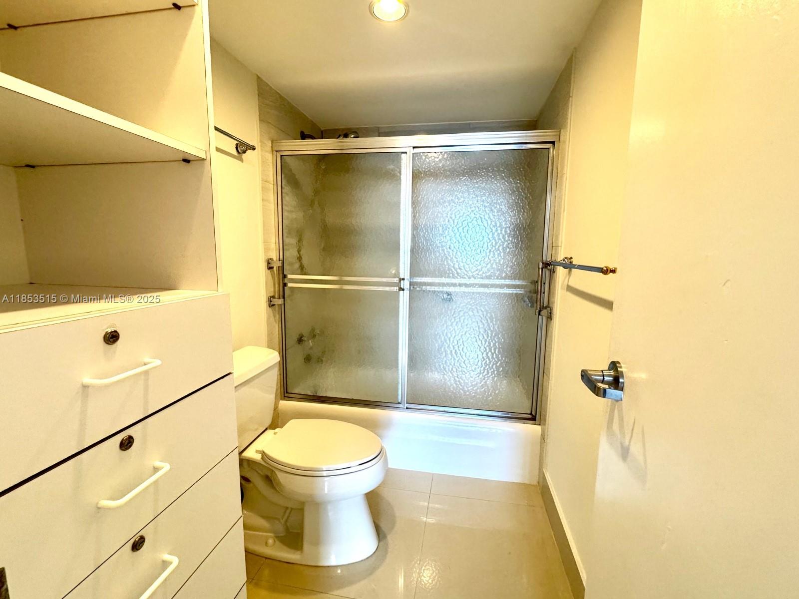 2333 Brickell Avenue, Unit 2607 Miami, FL 33129 - Photo 7 of 23 a bathroom with a shower and a toilet