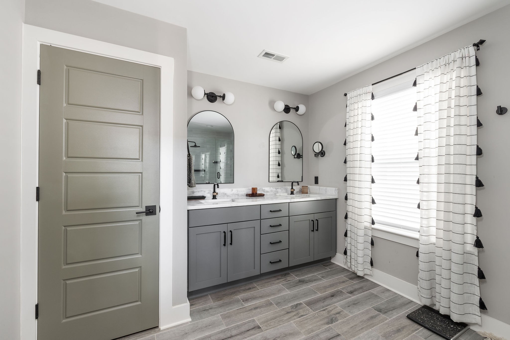 3415 Old Anderson Road Antioch, TN 37013 - Photo 24 of 46 a spacious bathroom with a double vanity sink a mirror and a shower