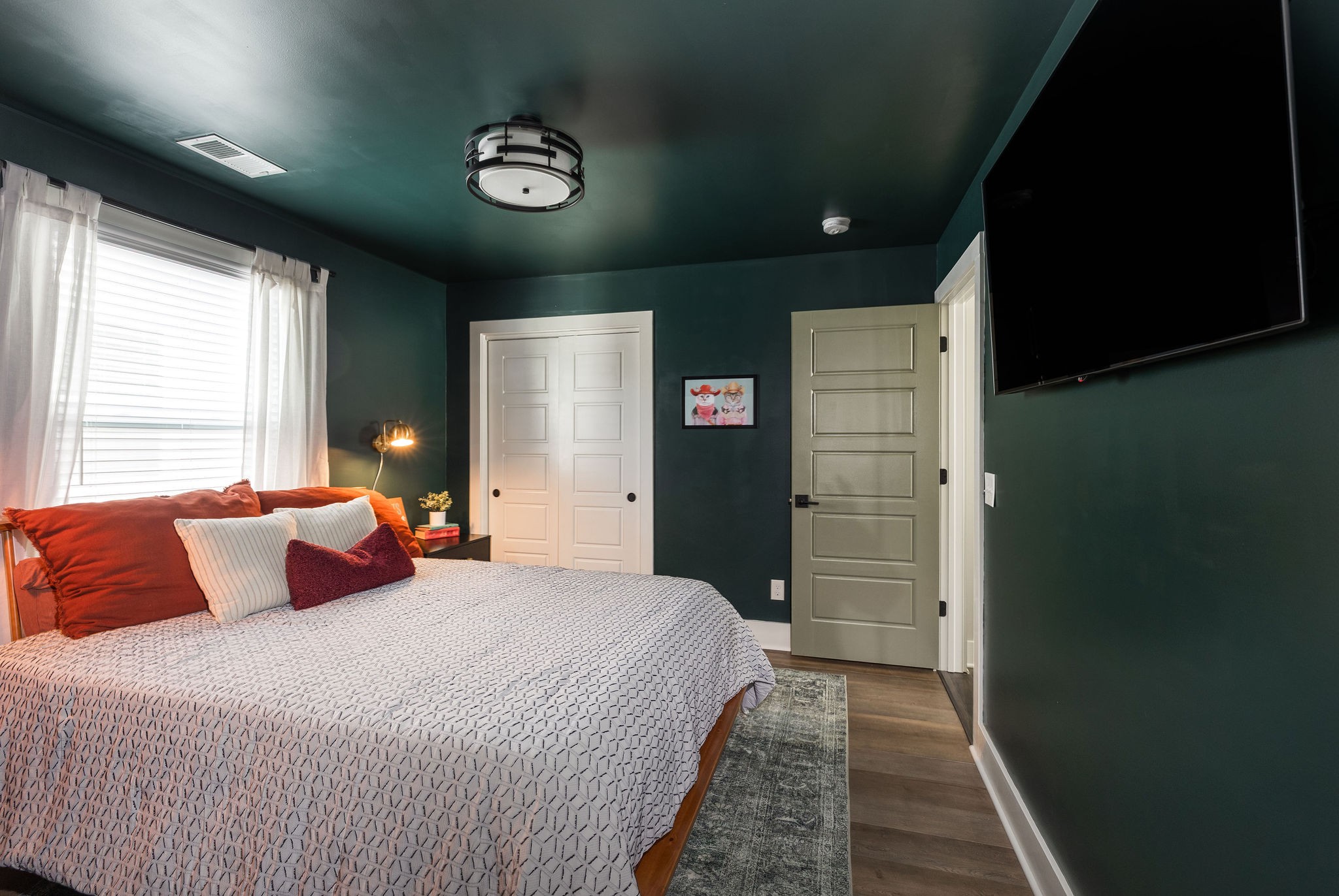 3415 Old Anderson Road Antioch, TN 37013 - Photo 33 of 46 a bedroom with a large bed and a chandelier