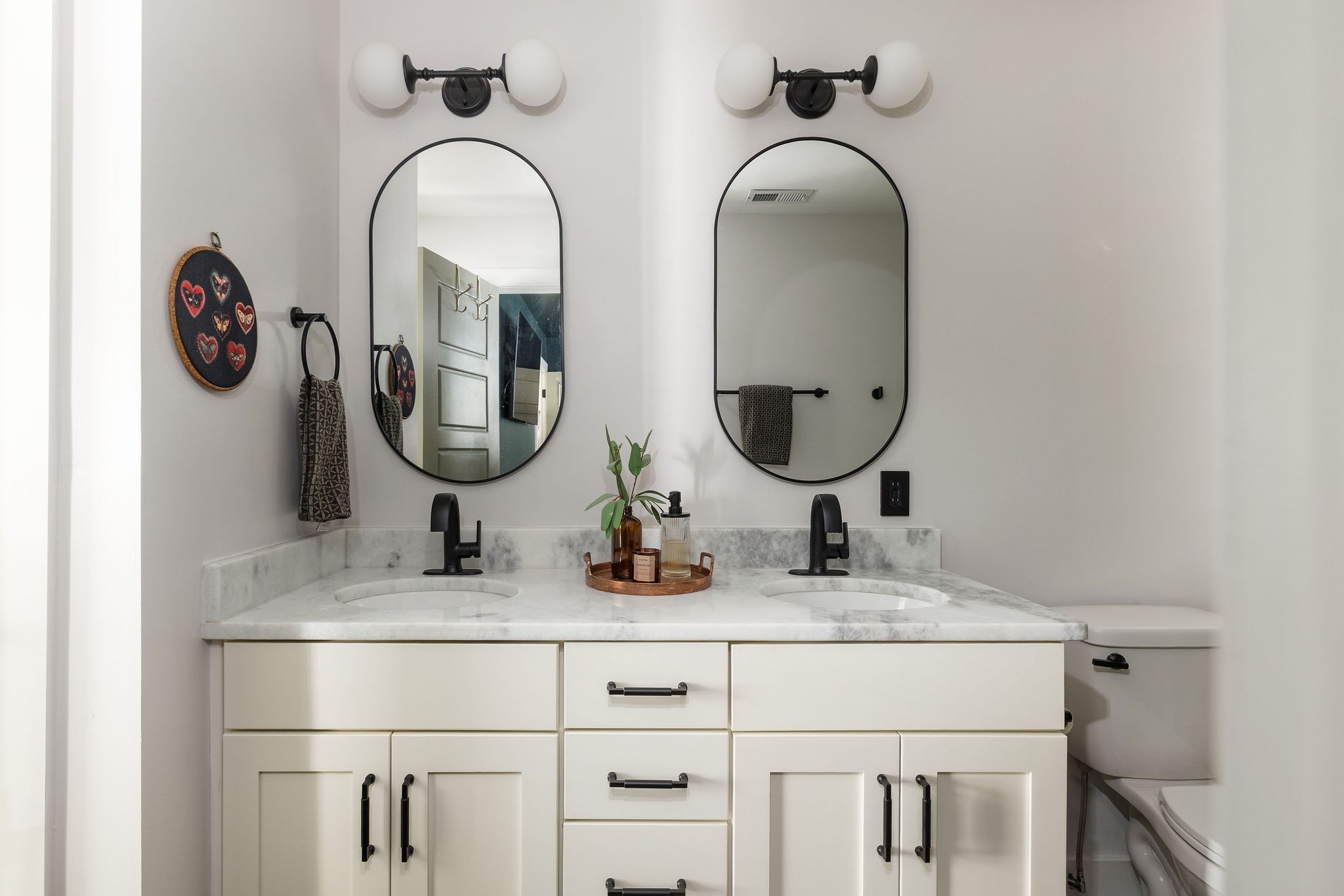 3415 Old Anderson Road Antioch, TN 37013 - Photo 34 of 46 a bathroom with a double vanity sink and a mirror