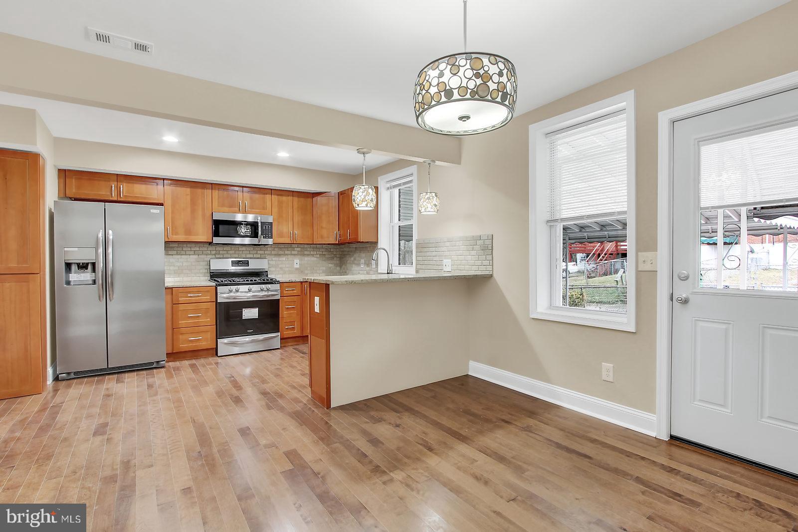 4059 Annellen Road Baltimore, MD 21215 - Photo 3 of 25 Dining Room and Kitchen