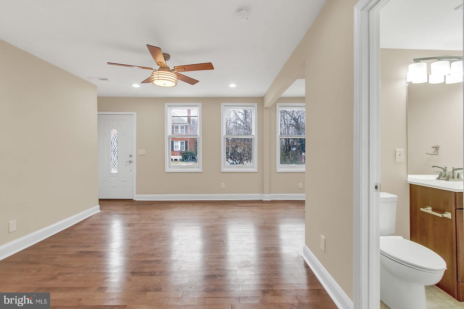 4059 Annellen Road Baltimore, MD 21215 - Photo 8 of 25 Living Room and Powder Room