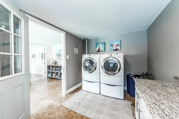 a utility room with dryer and washer