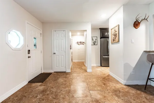 a view of a bathroom with tub and mirror