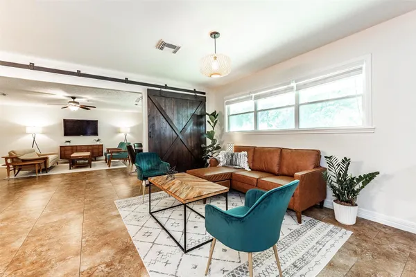 a outdoor space with furniture and a flat screen tv