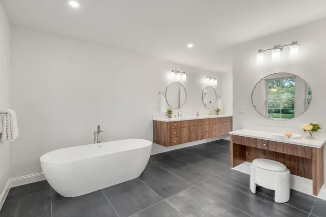 a view of a big room with wooden cabinet and windows