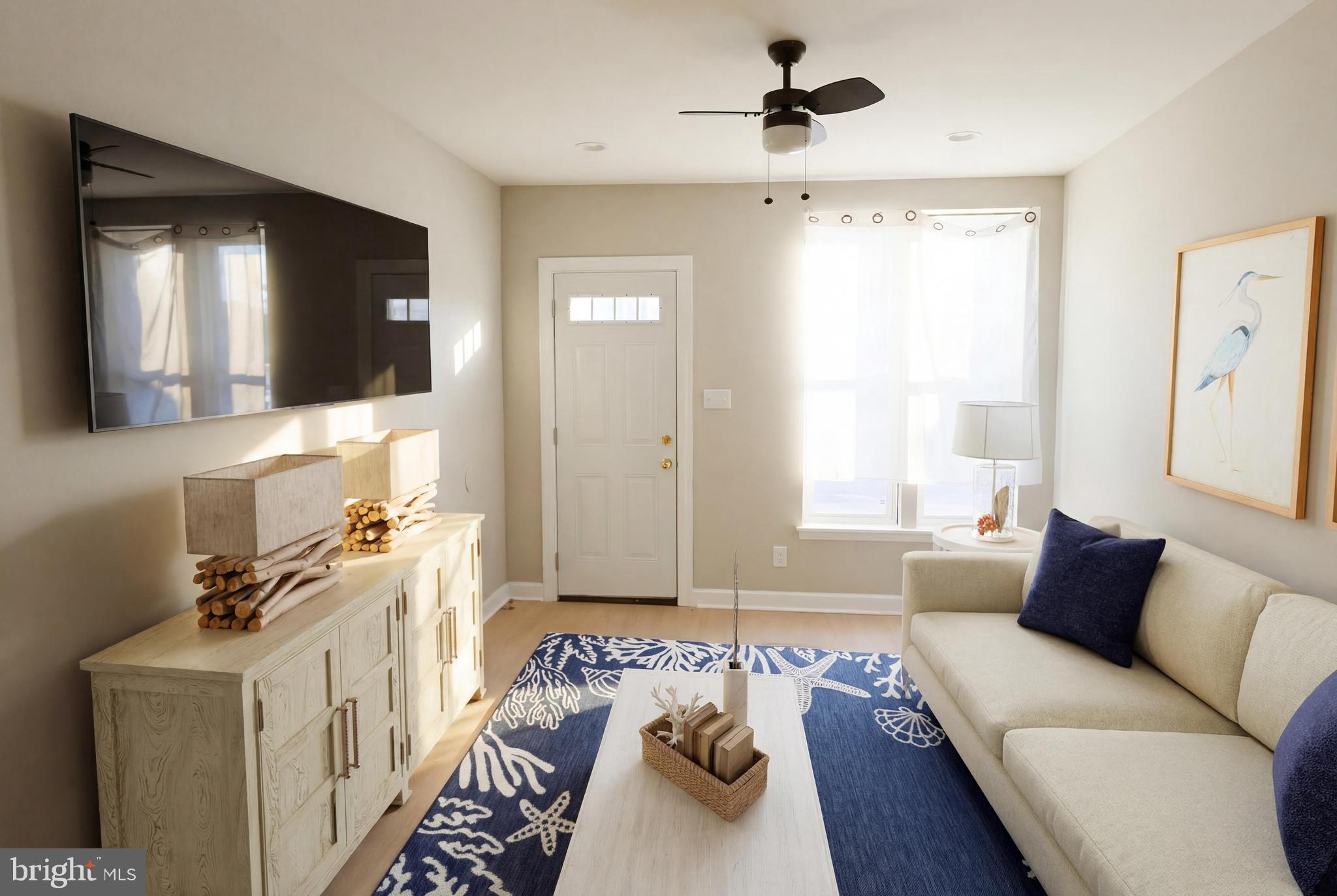 a living room with furniture and a flat screen tv