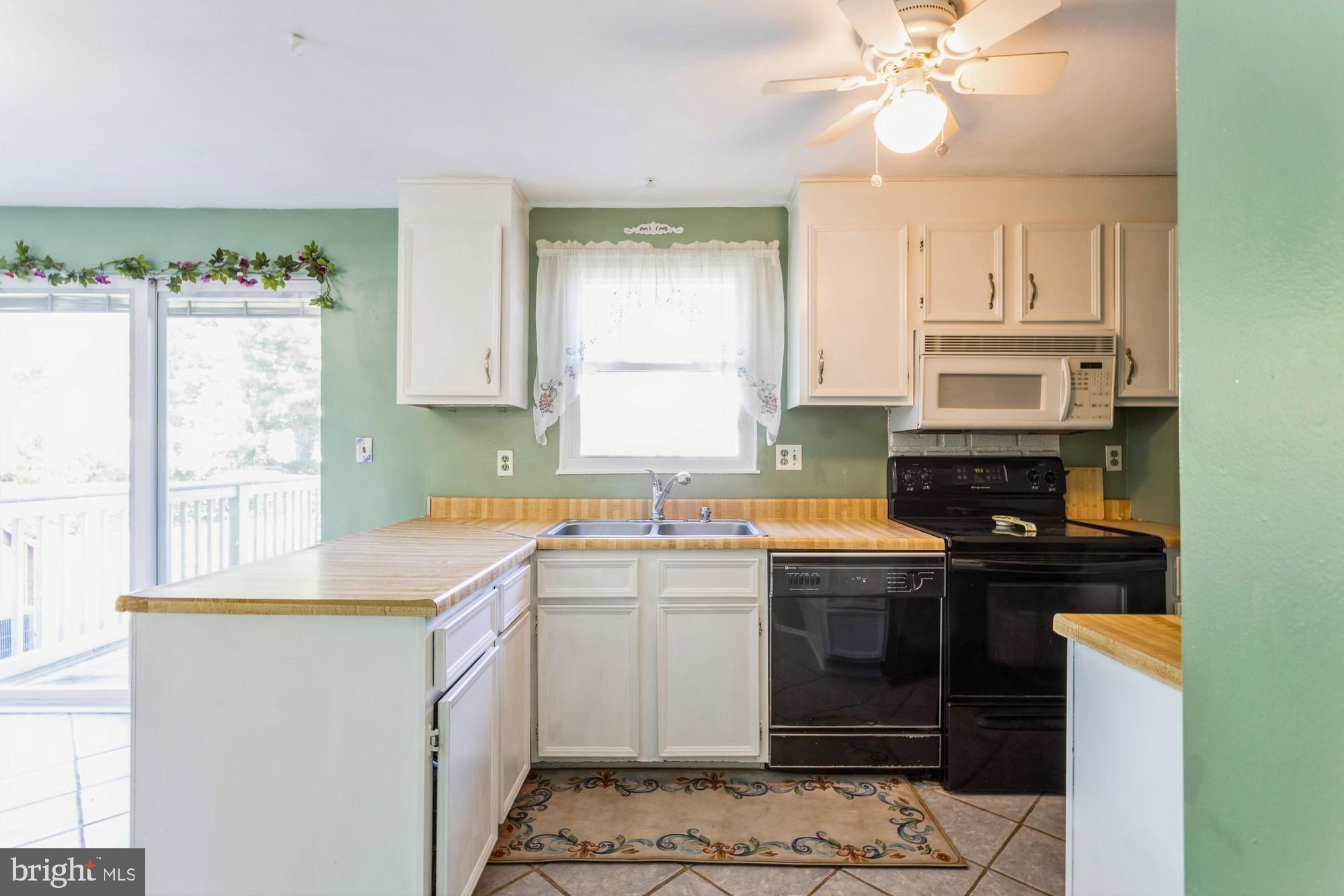 220 Drexel Drive Bel Air, MD 21014 - Photo 13 of 55 a kitchen with a sink stove and cabinets