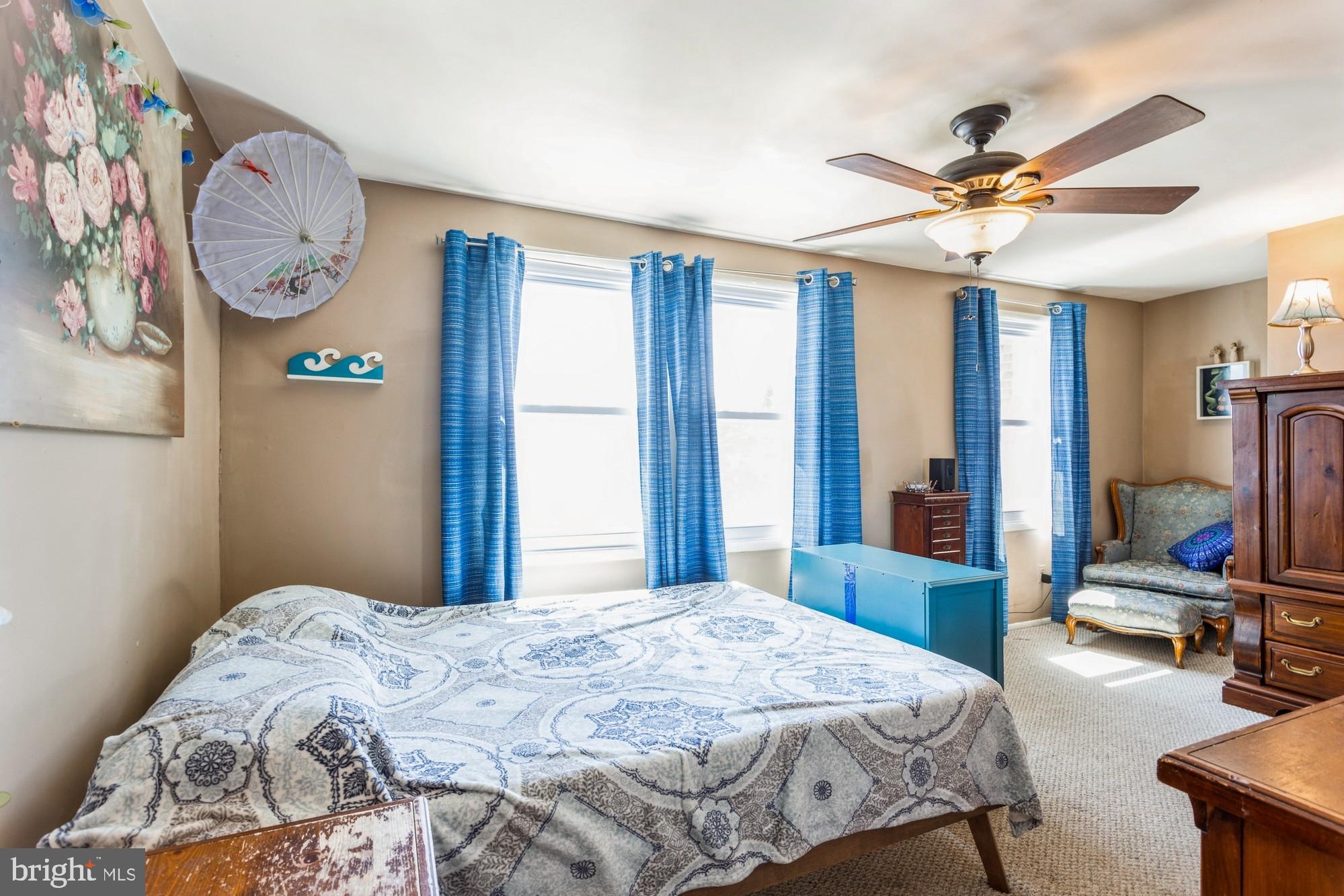 220 Drexel Drive Bel Air, MD 21014 - Photo 19 of 55 a bedroom with a bed and a chandelier