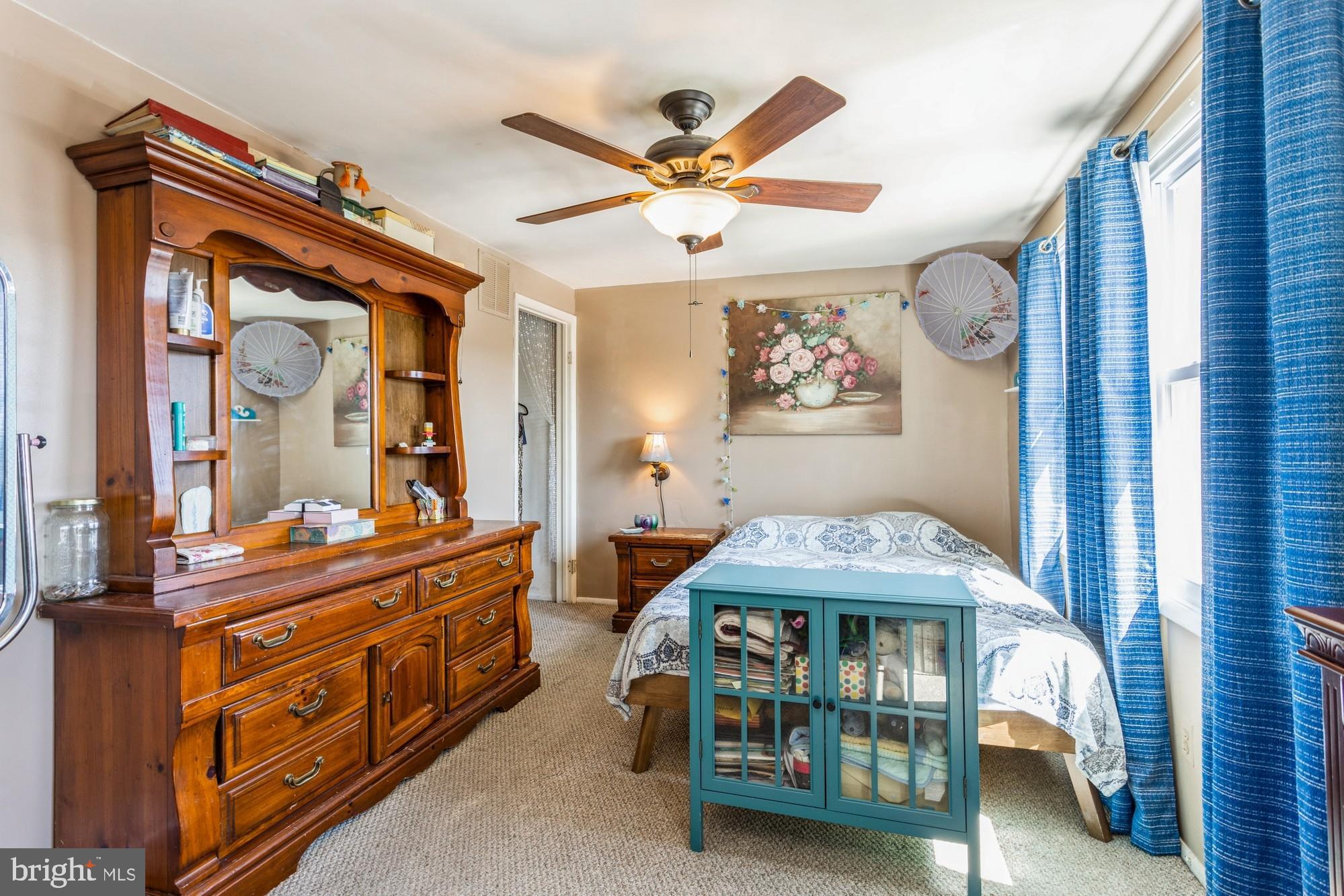 220 Drexel Drive Bel Air, MD 21014 - Photo 22 of 55 a bedroom with a bed and a chandelier