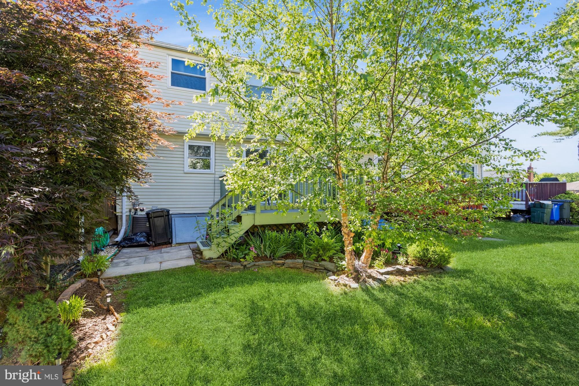 220 Drexel Drive Bel Air, MD 21014 - Photo 51 of 55 a view of a backyard with plants and a large tree
