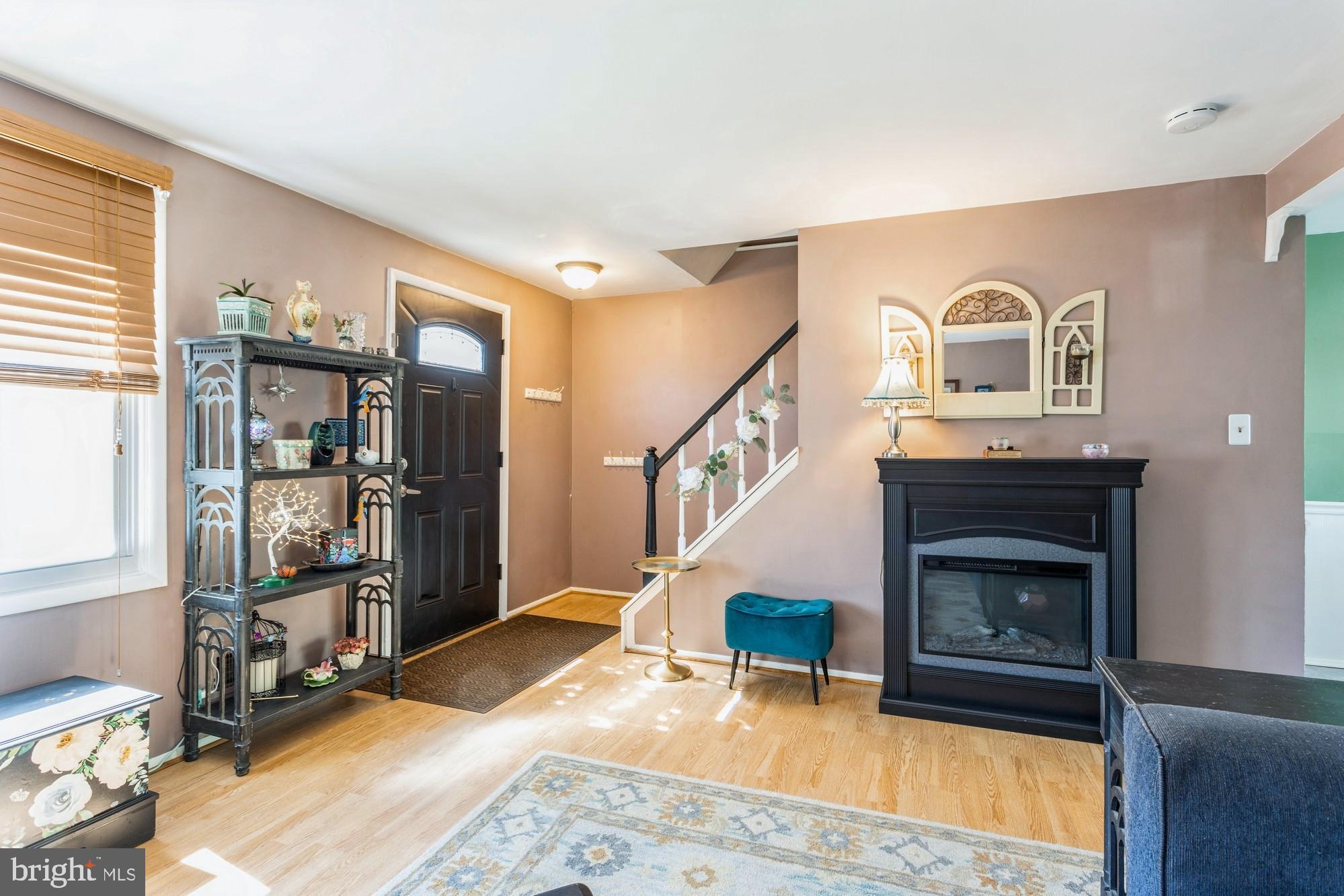 220 Drexel Drive Bel Air, MD 21014 - Photo 6 of 55 a living room with furniture a fireplace and a window