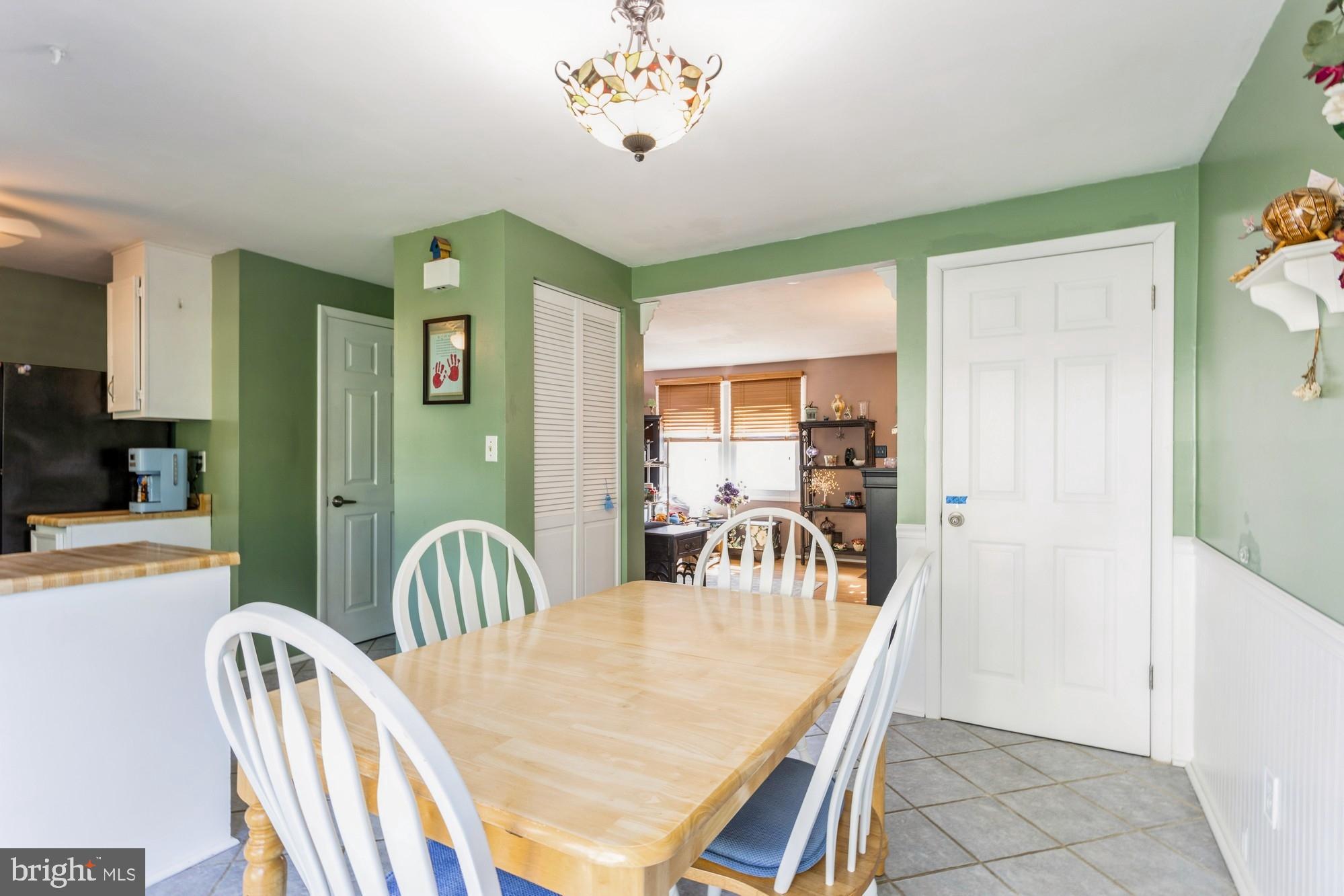 220 Drexel Drive Bel Air, MD 21014 - Photo 8 of 55 a view of a dining room with furniture and a chandelier