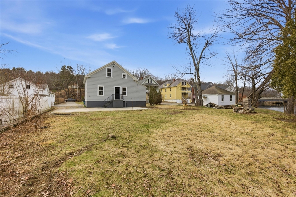 2120 Providence Road Northbridge, MA 01534 - Photo 12 of 12 a house with a large tree in front of it