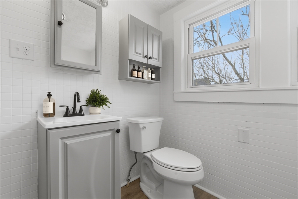2120 Providence Road Northbridge, MA 01534 - Photo 8 of 12 a bathroom with a toilet a sink and a window