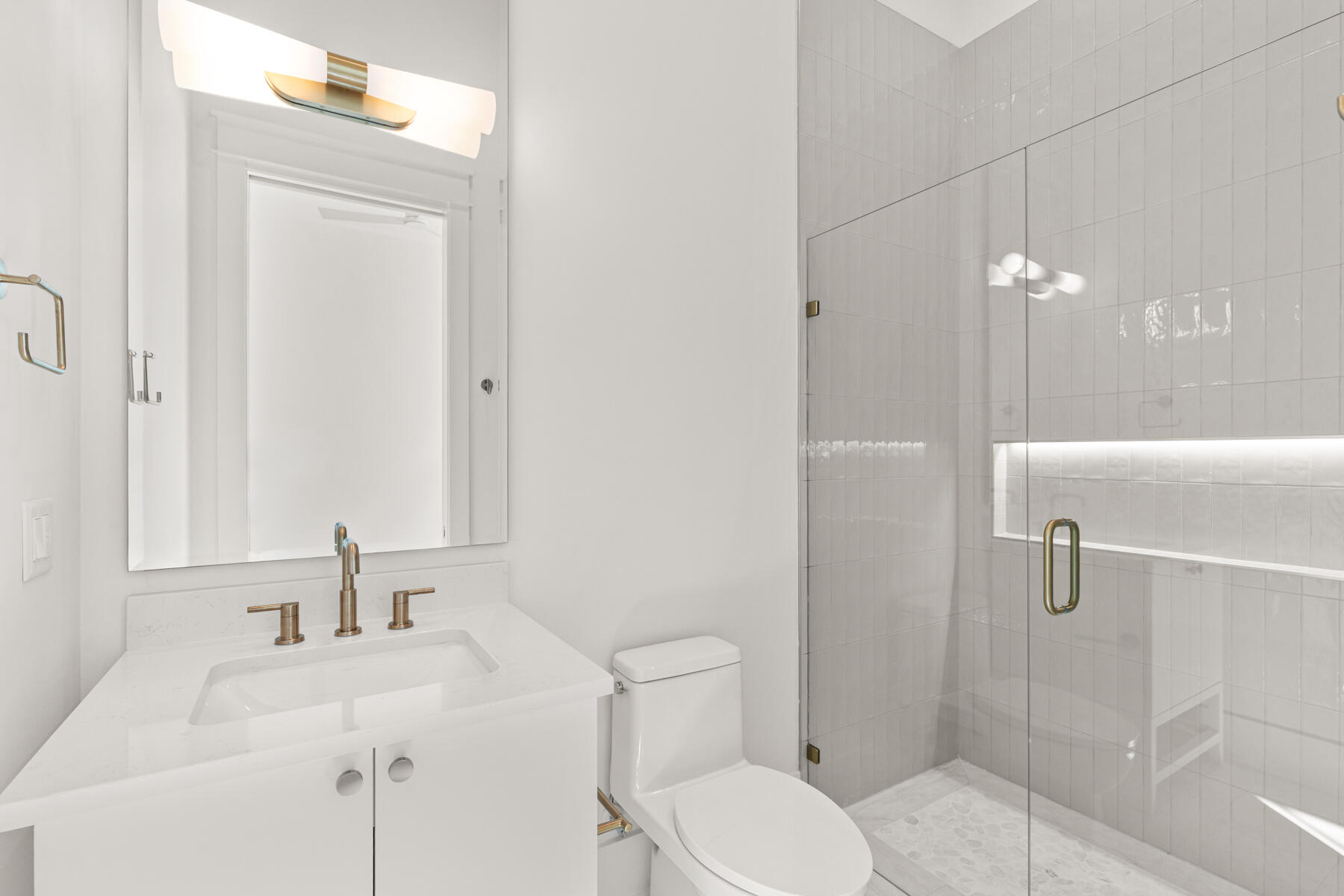 74 Pollard Cove West, Unit LOT 41 Watersound, FL 32461 - Photo 14 of 62 a bathroom with a sink a toilet and shower