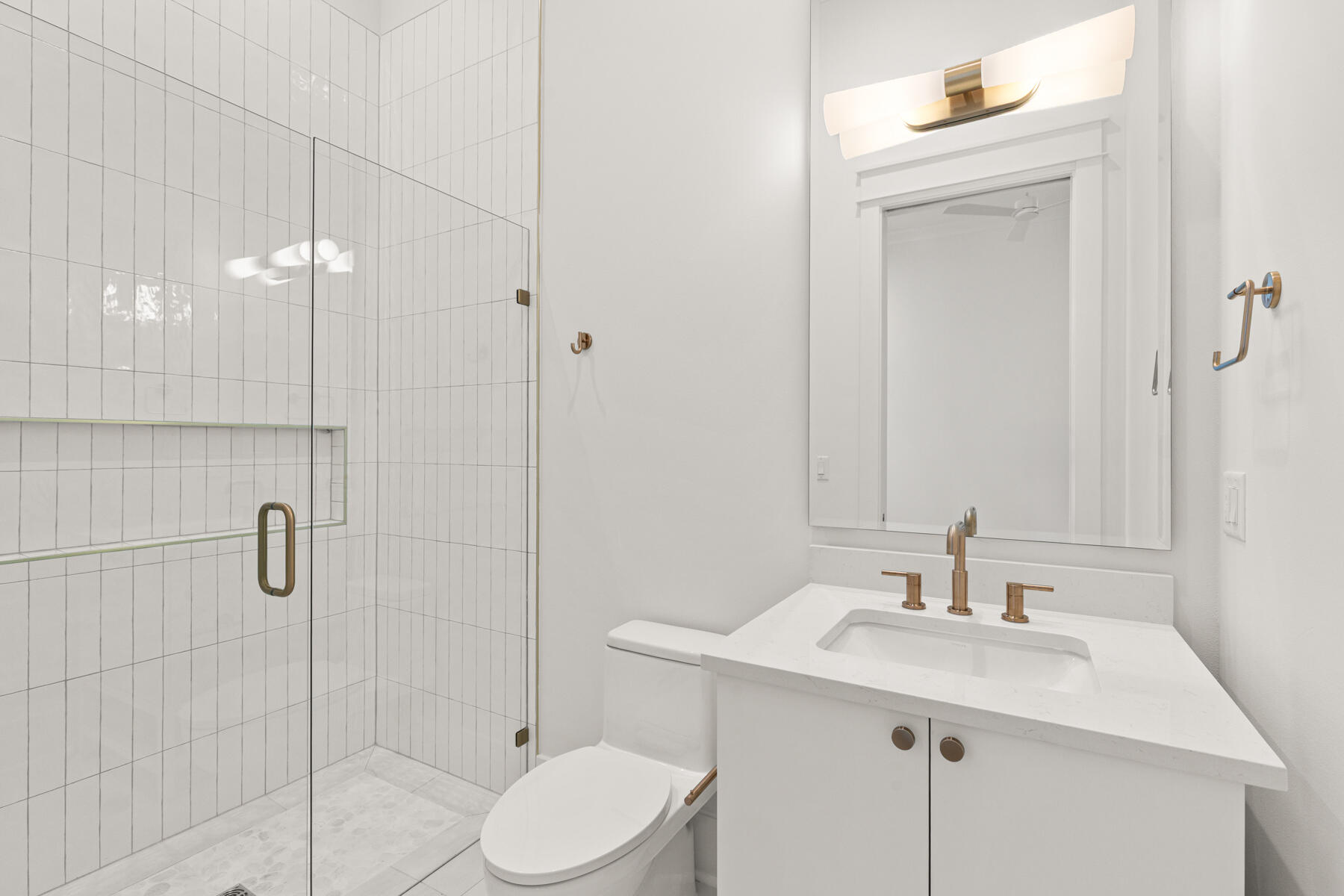 74 Pollard Cove West, Unit LOT 41 Watersound, FL 32461 - Photo 17 of 62 a bathroom with a sink toilet and shower