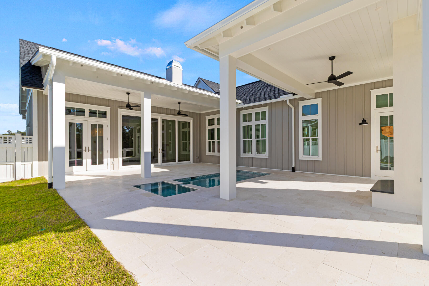 74 Pollard Cove West, Unit LOT 41 Watersound, FL 32461 - Photo 42 of 62 a view of a patio with table and chairs
