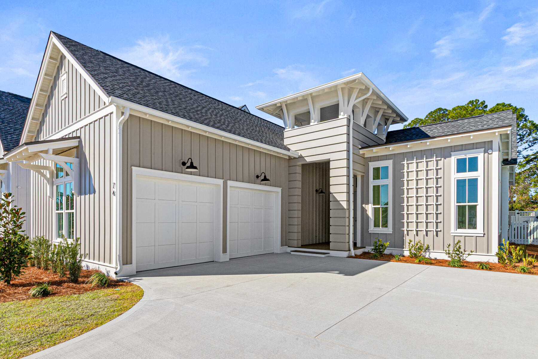 74 Pollard Cove West, Unit LOT 41 Watersound, FL 32461 - Photo 43 of 62 a front view of a house with a yard