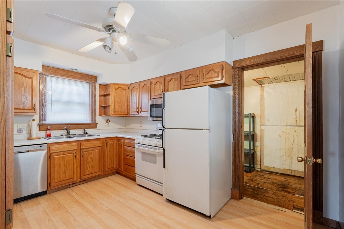 321 East 2nd Street El Paso, IL 61738 - Photo 12 of 37 a kitchen with stainless steel appliances a refrigerator and a sink