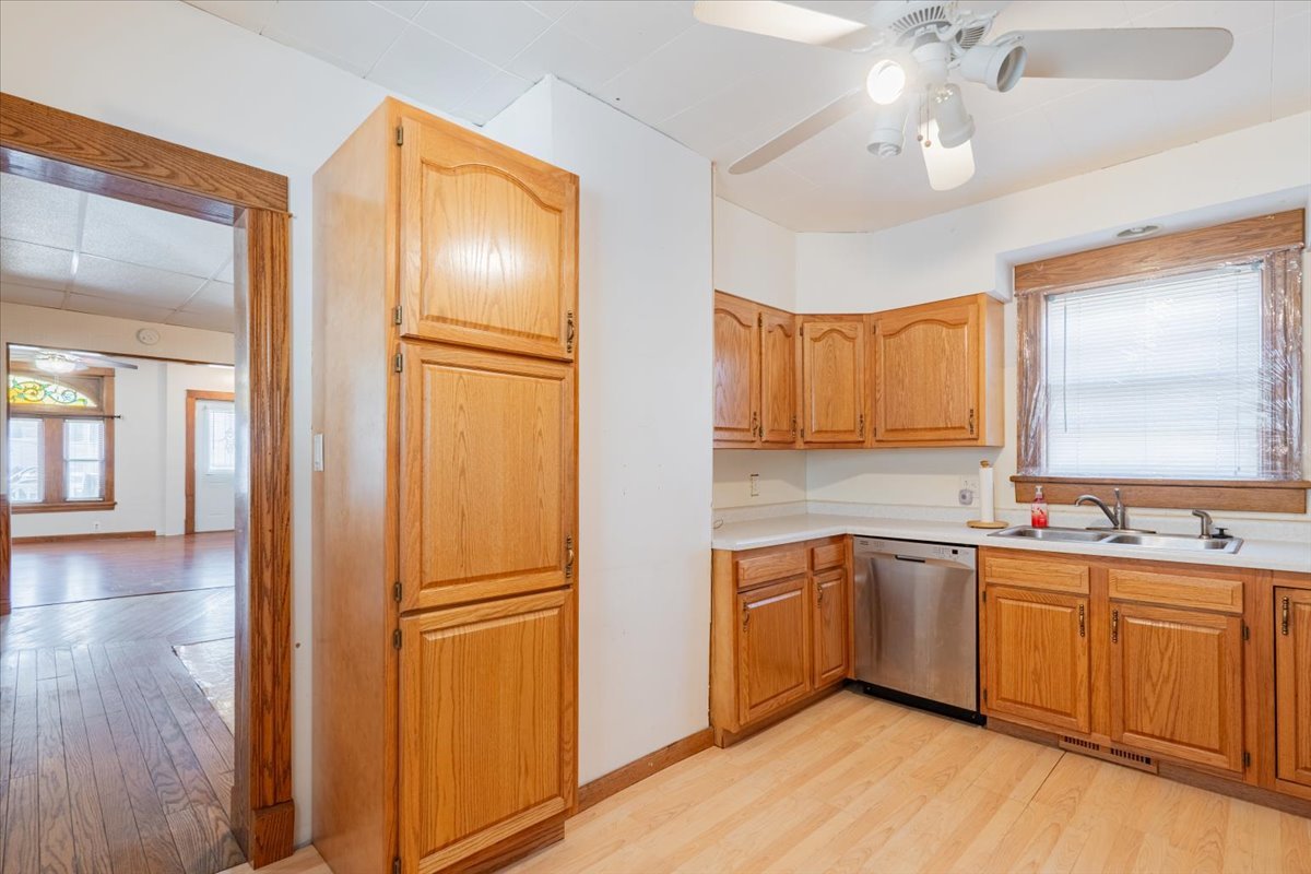 321 East 2nd Street El Paso, IL 61738 - Photo 14 of 37 a kitchen with stainless steel appliances granite countertop cabinets and wooden floor