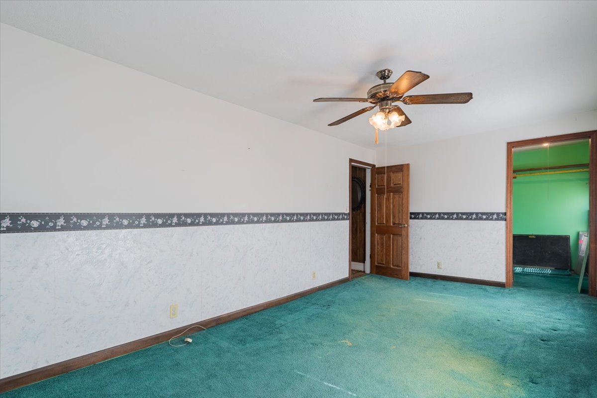 321 East 2nd Street El Paso, IL 61738 - Photo 19 of 37 a view of room with hardwood floor and a ceiling fan