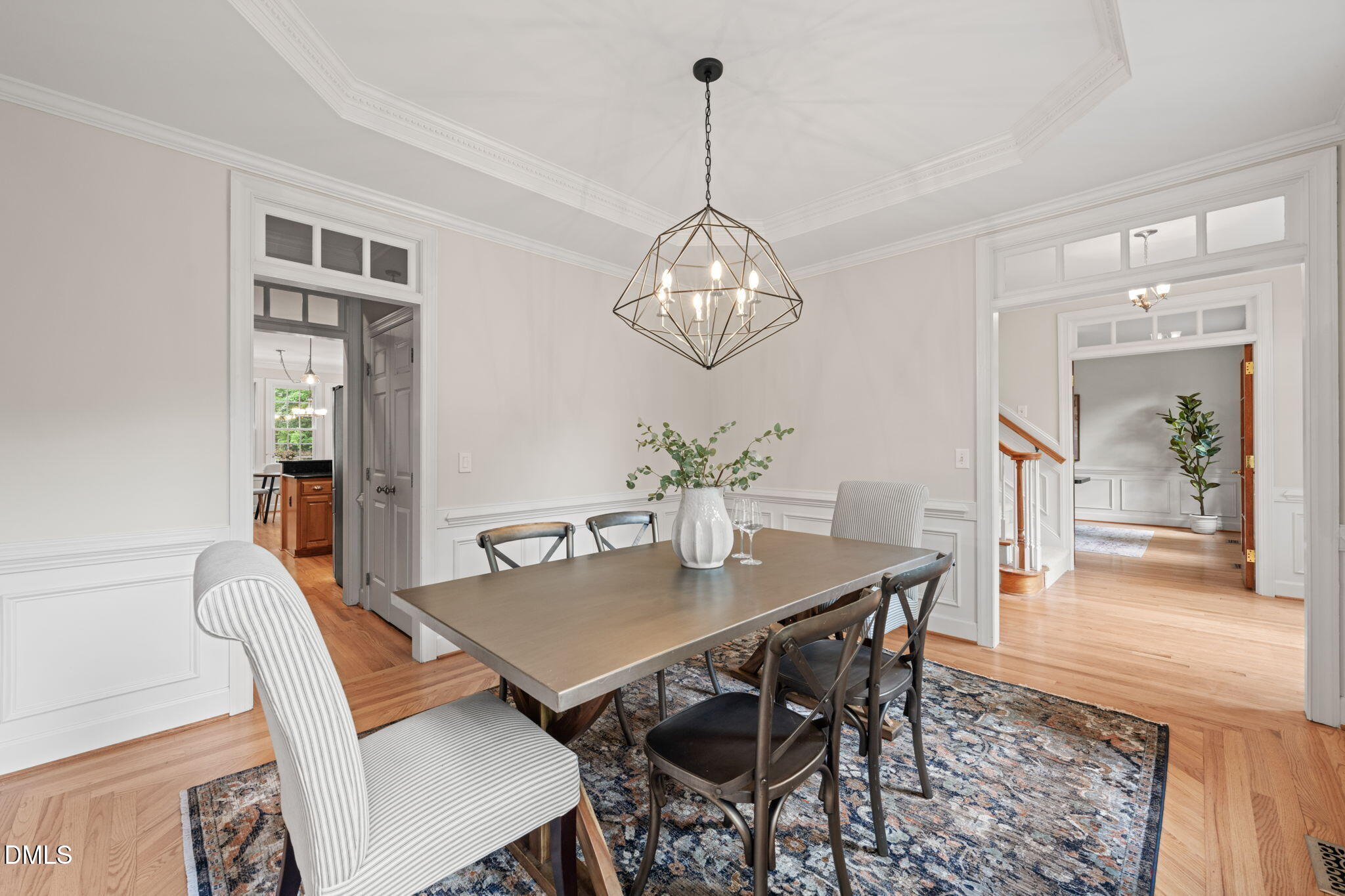 5809 Stone Spring Road Raleigh, NC 27613 - Photo 8 of 54 a view of a dining room with furniture and wooden floor