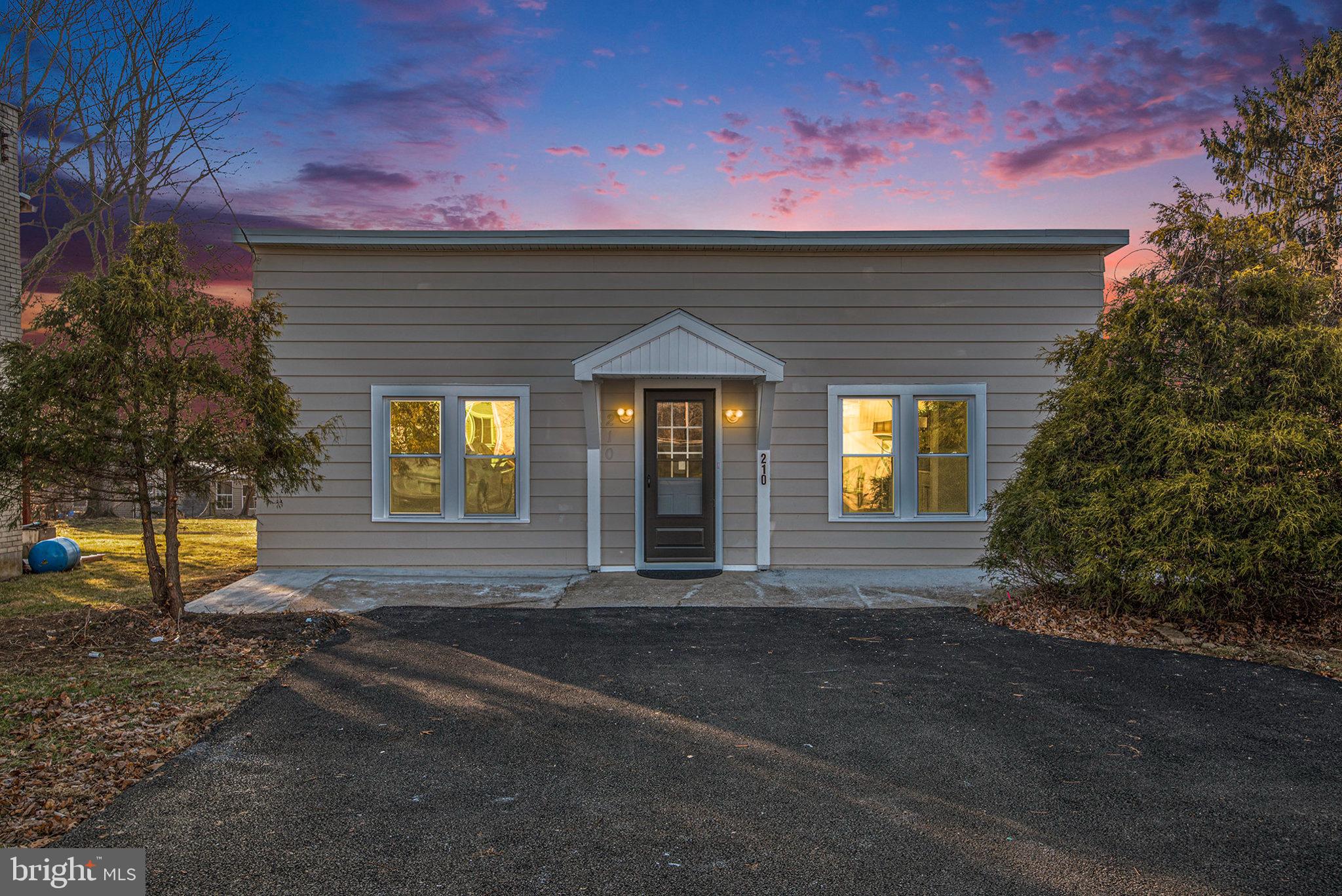 210 Beaver Road Harrisburg, PA 17112 - Photo 2 of 32 a front view of a house with a yard