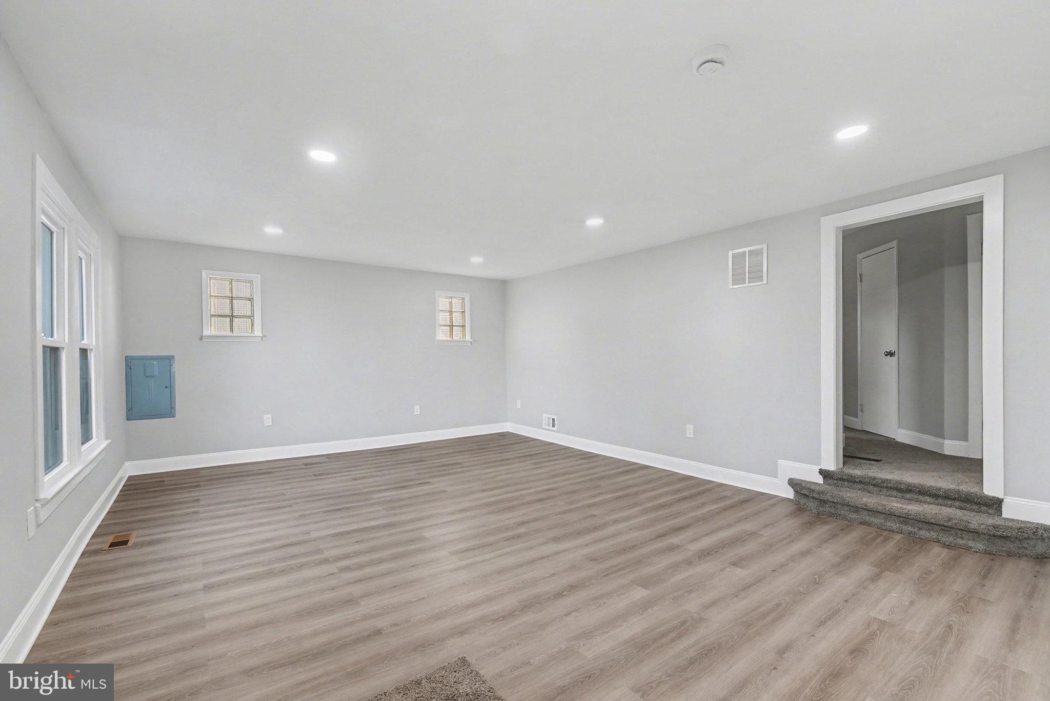 210 Beaver Road Harrisburg, PA 17112 - Photo 6 of 32 an empty room with wooden floor and windows