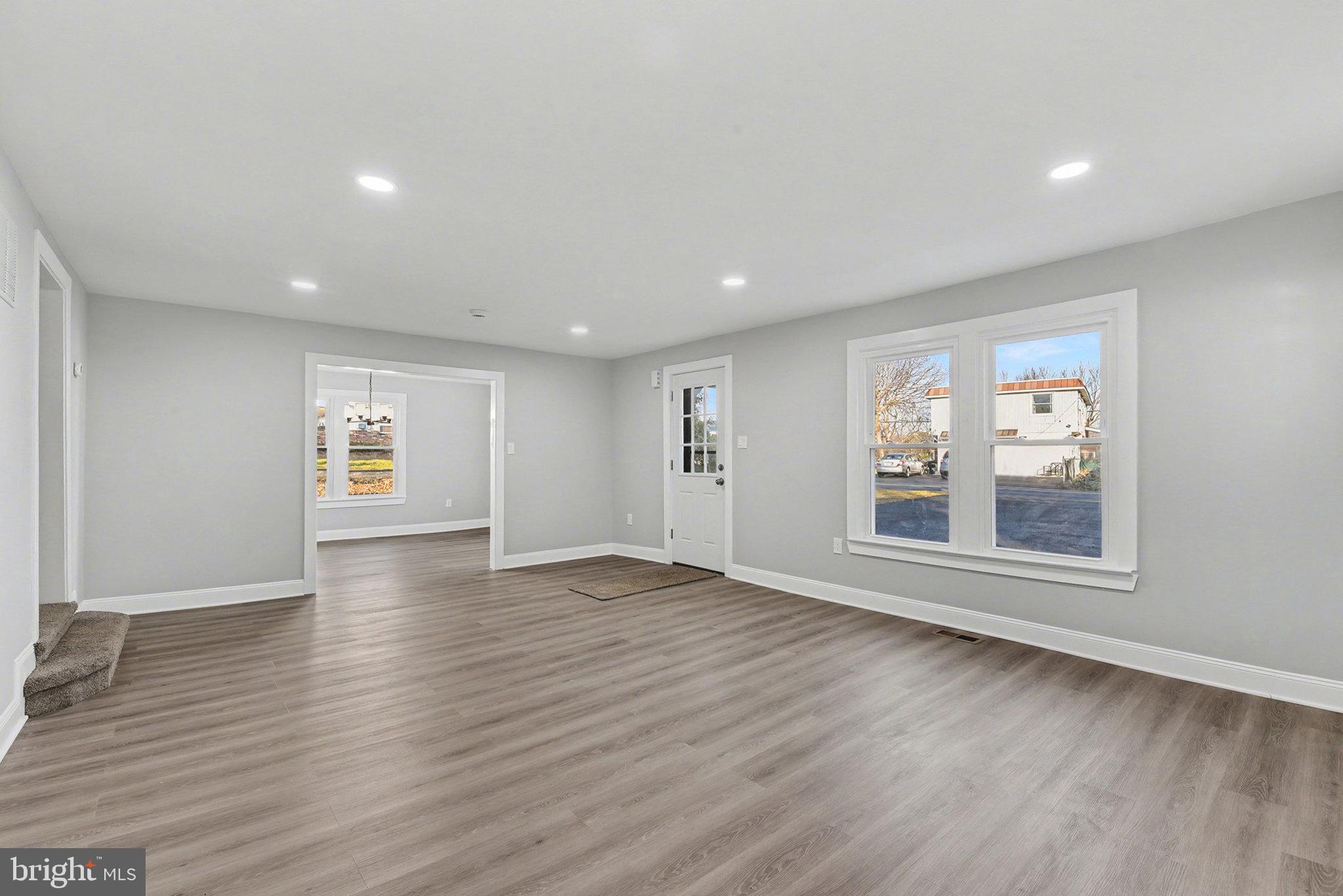 210 Beaver Road Harrisburg, PA 17112 - Photo 7 of 32 an empty room with wooden floor and windows