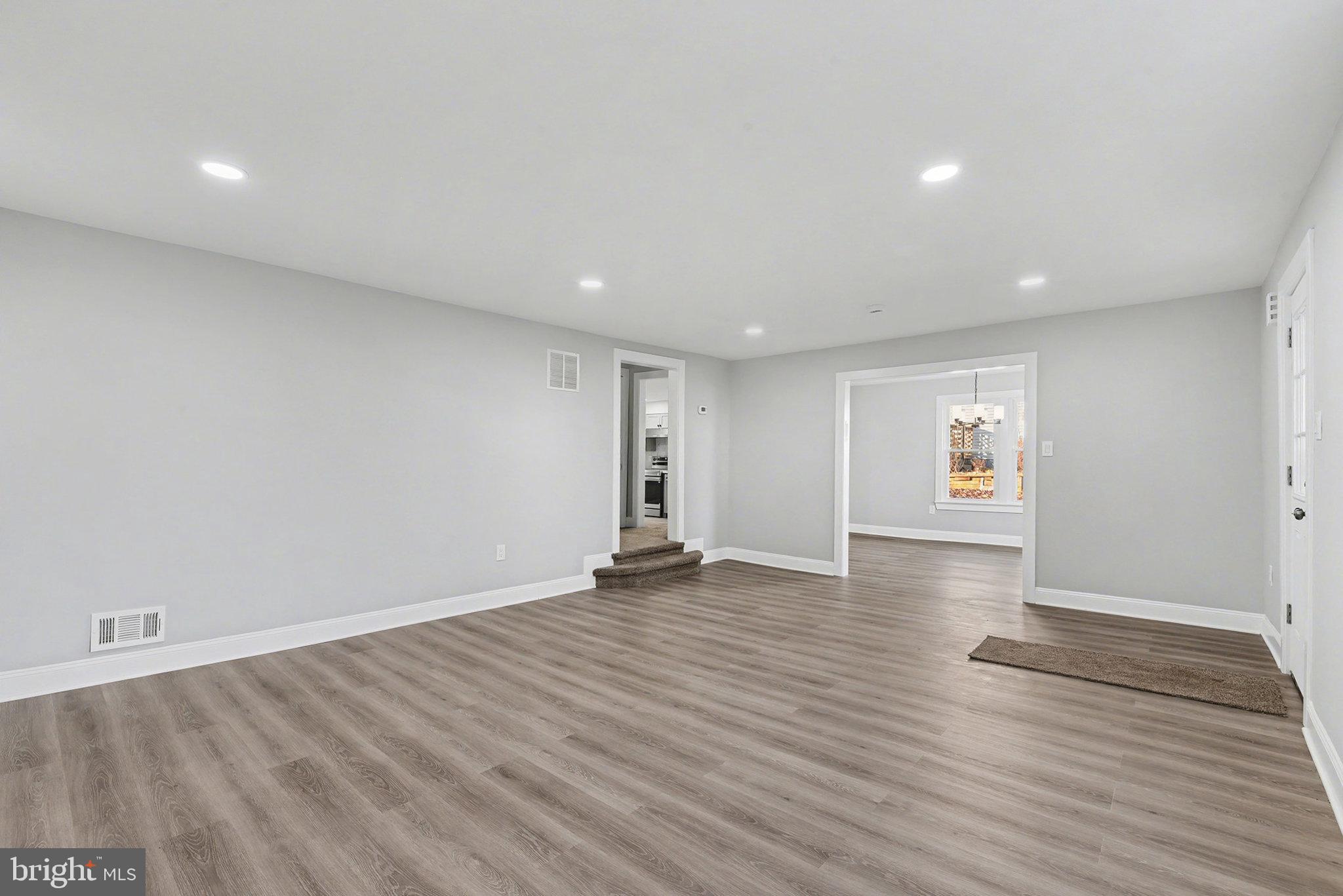 210 Beaver Road Harrisburg, PA 17112 - Photo 8 of 32 a view of an empty room with wooden floor and a window