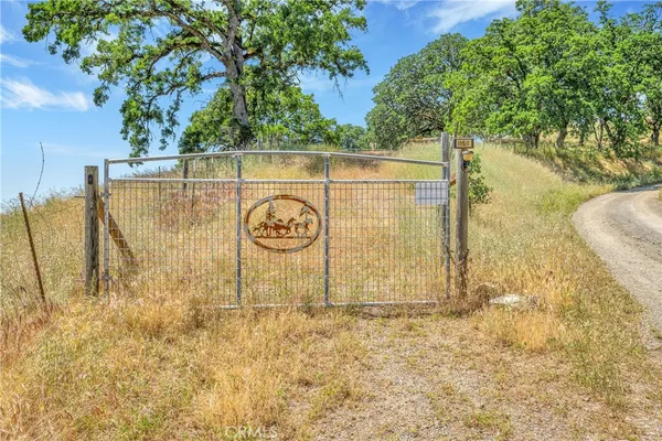 a backyard of a house with wooden floor and fence
