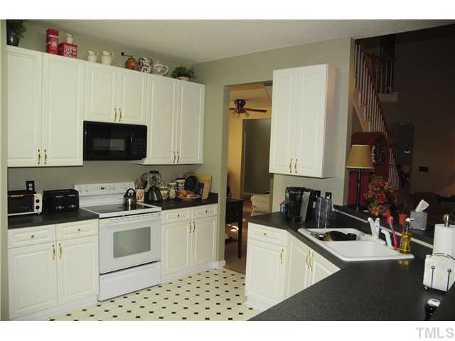 12321 Amoretto Way Raleigh, NC 27613 - Photo 3 of 9 Large kitchen with 42" white cabinets and plenty of counter space