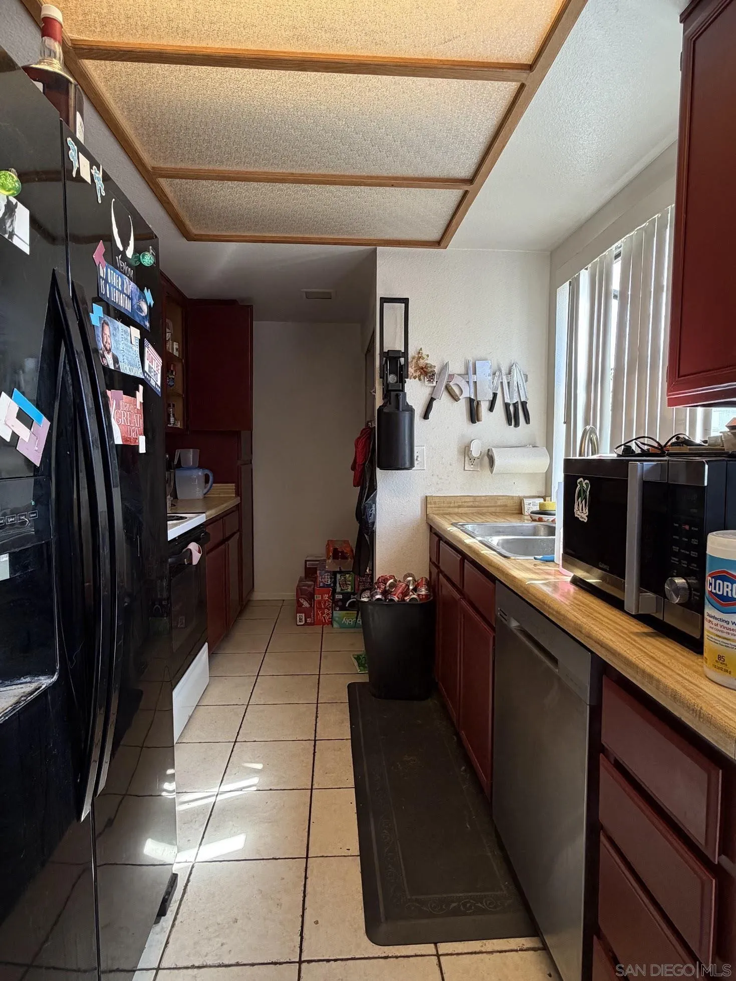 12741 Laurel Street, Unit 58 Lakeside, CA 92040 - Photo 2 of 12 a kitchen with a sink and cabinets