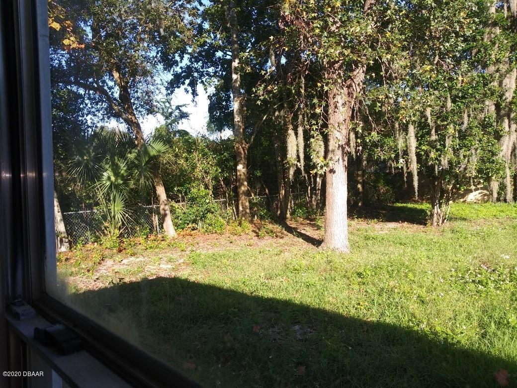 939 West Granada Boulevard Ormond Beach, FL 32174 - Photo 14 of 14 a view of outdoor space with garden