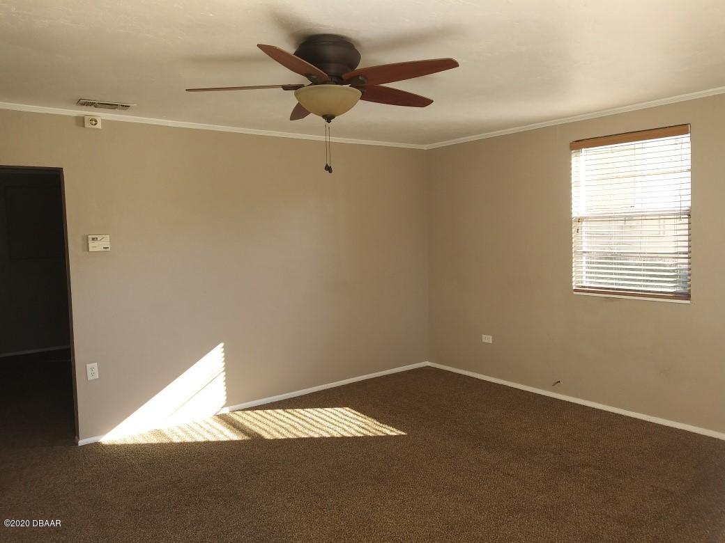 939 West Granada Boulevard Ormond Beach, FL 32174 - Photo 5 of 14 a view of an empty room with a window