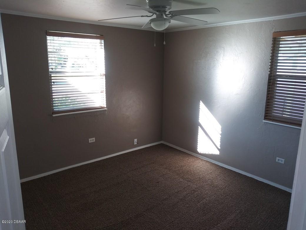 939 West Granada Boulevard Ormond Beach, FL 32174 - Photo 8 of 14 a view of an empty room with a window