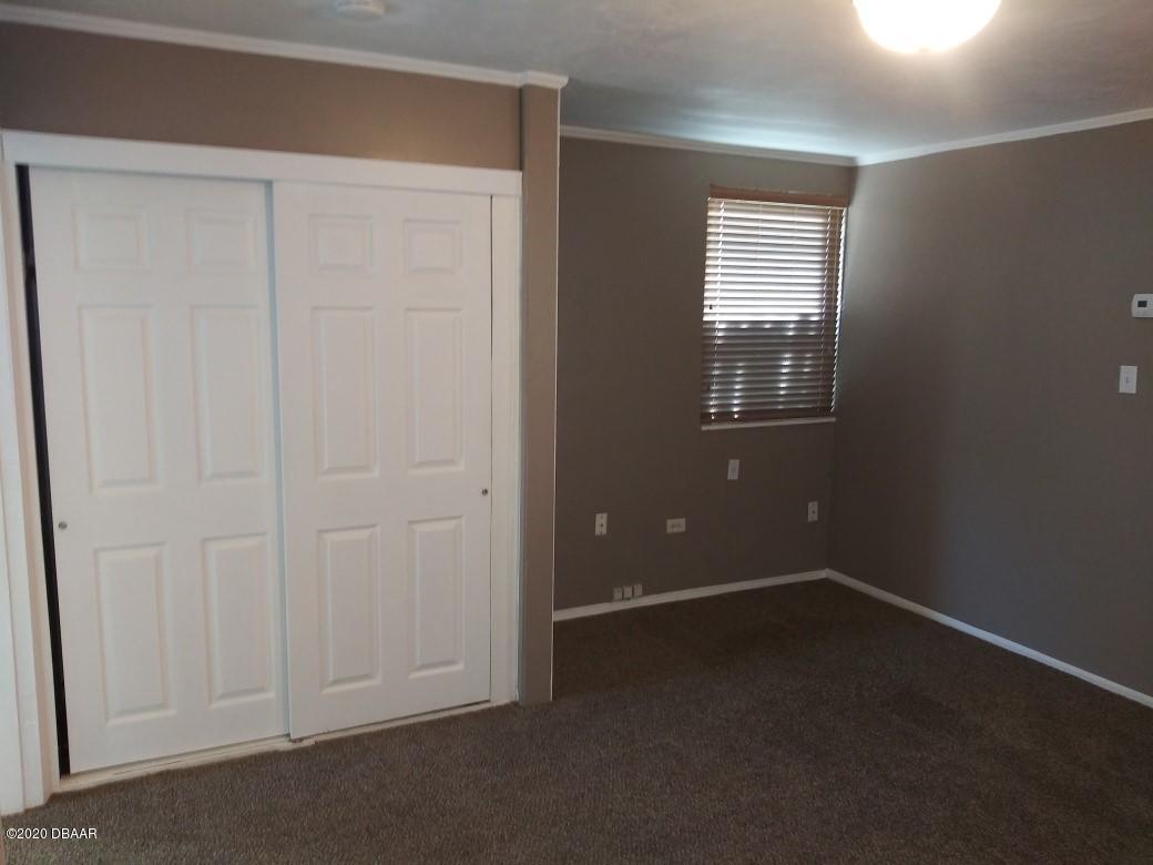 939 West Granada Boulevard Ormond Beach, FL 32174 - Photo 10 of 14 an empty room with windows