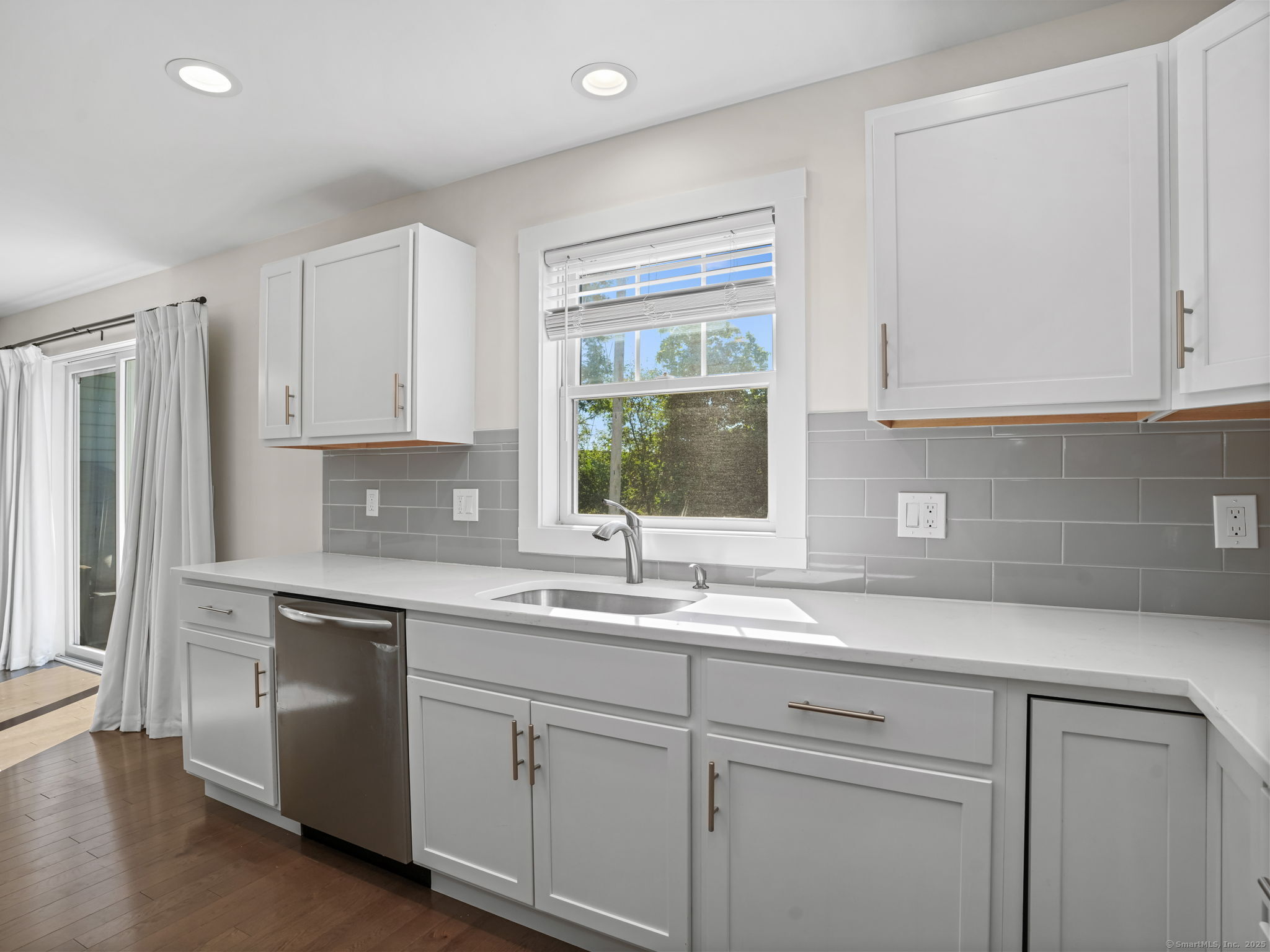 118 Berwick Avenue, Unit 118 Fairfield, CT 06825 - Photo 12 of 29 a kitchen with granite countertop white cabinets and white appliances