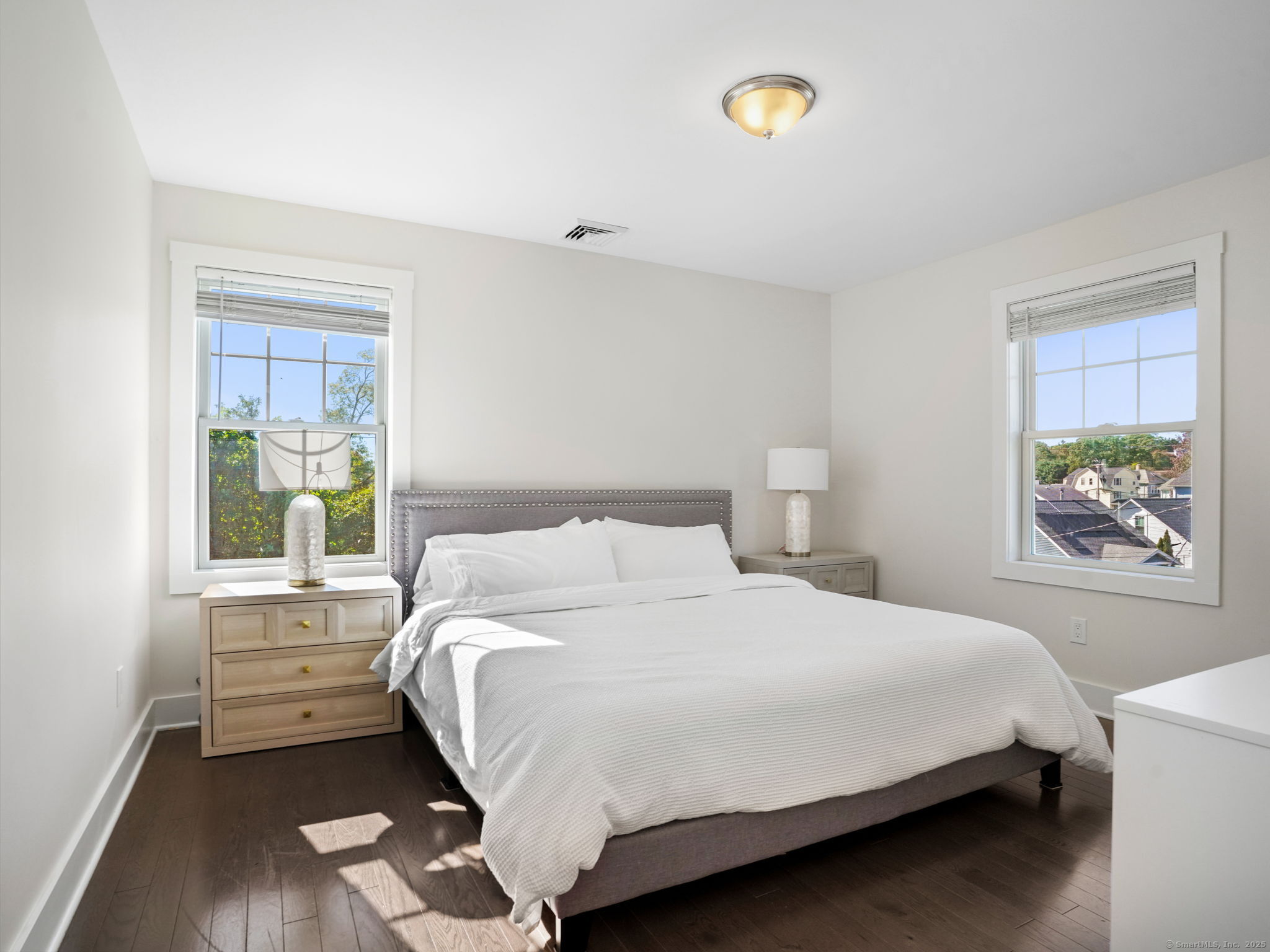 118 Berwick Avenue, Unit 118 Fairfield, CT 06825 - Photo 14 of 29 a bedroom with a bed and a window