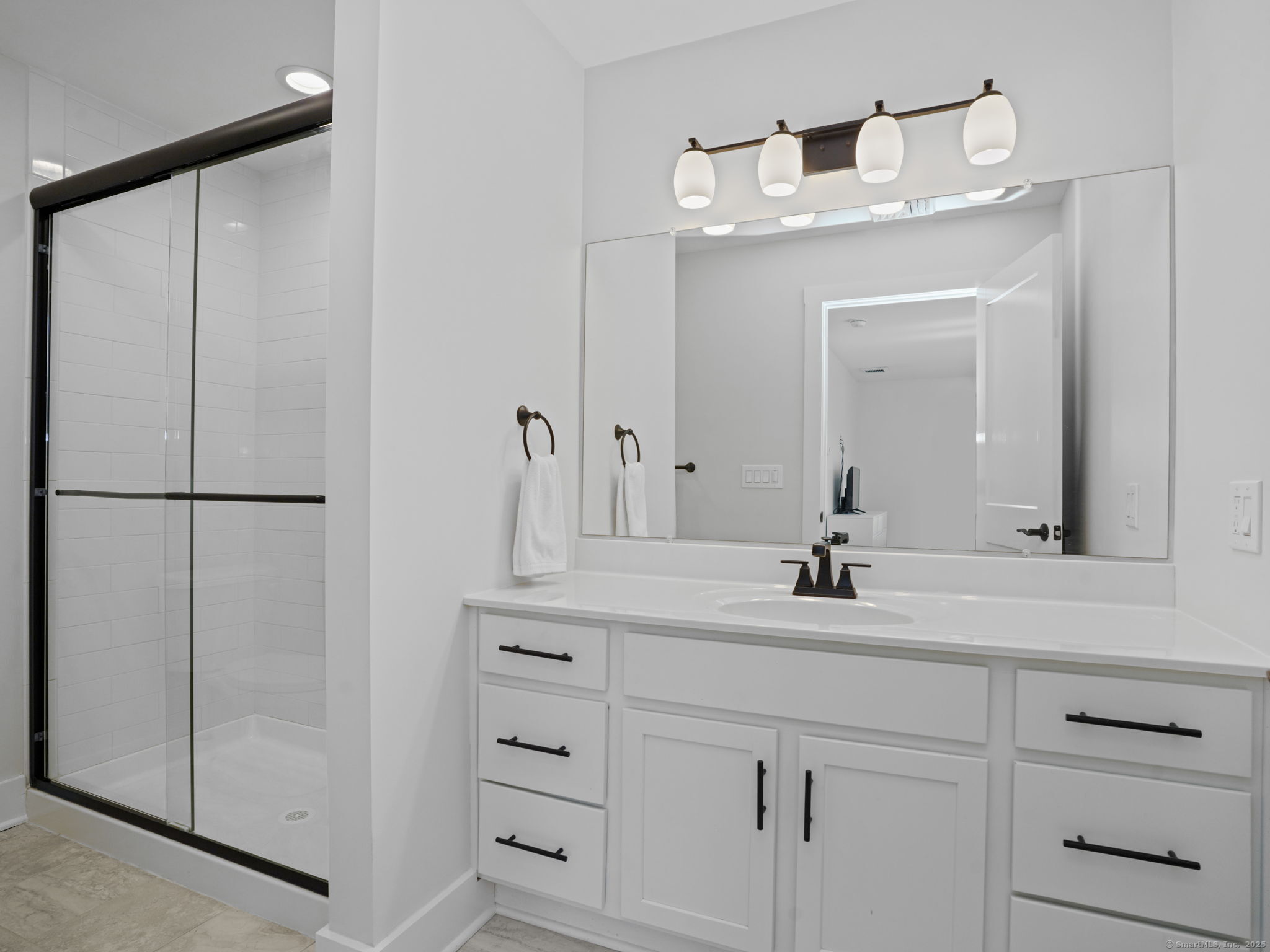 118 Berwick Avenue, Unit 118 Fairfield, CT 06825 - Photo 16 of 29 a bathroom with a double vanity sink and mirror